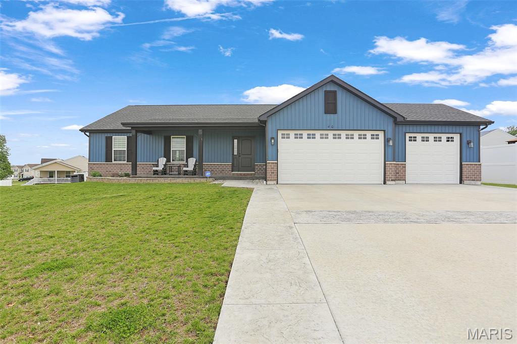Welcome to 40 Mill Point Court! This 2 year old home is a must see. Spacious living room and kitchen, 3 bedrooms, and 2 bathrooms on the main level. Full basement. The back yard has a nice patio and is full fenced in. If you have kids in the elementary and middle school, you will LOVE this location! Enjoy unique amenities like a stamped concrete driveway, lush sodded yard, 3-car garage, and inviting open floor plan. You can see both schools from the front yard! Grab your favorite Realtor and schedule a showing today.