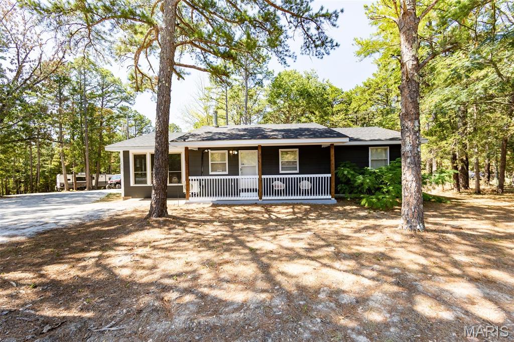 OUTDOORSMAN’S DREAM — 18+/- ACRES, STOCKED POND, SHOP & UPDATED HOME!

If you’ve been searching for the perfect country property, don't sleep on this one! Situated on 18 wooded acres with trails throughout, this property offers privacy, recreation, and plenty of room to enjoy the great outdoors. The land has never been timbered and features a beautiful 1.5-acre stocked pond with a fishing dock, making it an ideal setting for fishing, hunting, exploring, or simply enjoying the views.
Step inside the 3-bedroom, 2-bath ranch-style home and you’ll appreciate the abundance of natural light and recent updates throughout. The home features fresh paint, new lighting, and all-new appliances, including a convenient all-in-one washer/dryer.
Enjoy the outdoors from the covered front deck or spacious back deck with a gazebo, perfect for entertaining and/or relaxing.  A 3-person deer stand & trails are already in place for the hunting enthusiast.
The impressive 26x36 shop features a concrete floor, electricity, insulation, and a mini-split, offering an excellent space for equipment, vehicles, hobbies, a workshop, or recreational gear. An underground storm shelter provides added peace of mind.
Located on blacktop and surrounded by some of the area's finest recreational opportunities, near thousands of acres of Mark Twain National Forest, the Big Piney River, Paddy Creek Wilderness Area, and Boiling Springs.
Whether you're looking for a private homestead, hunting retreat, recreational getaway, or simply a place to spread out and enjoy country living, this exceptional property checks all the boxes!