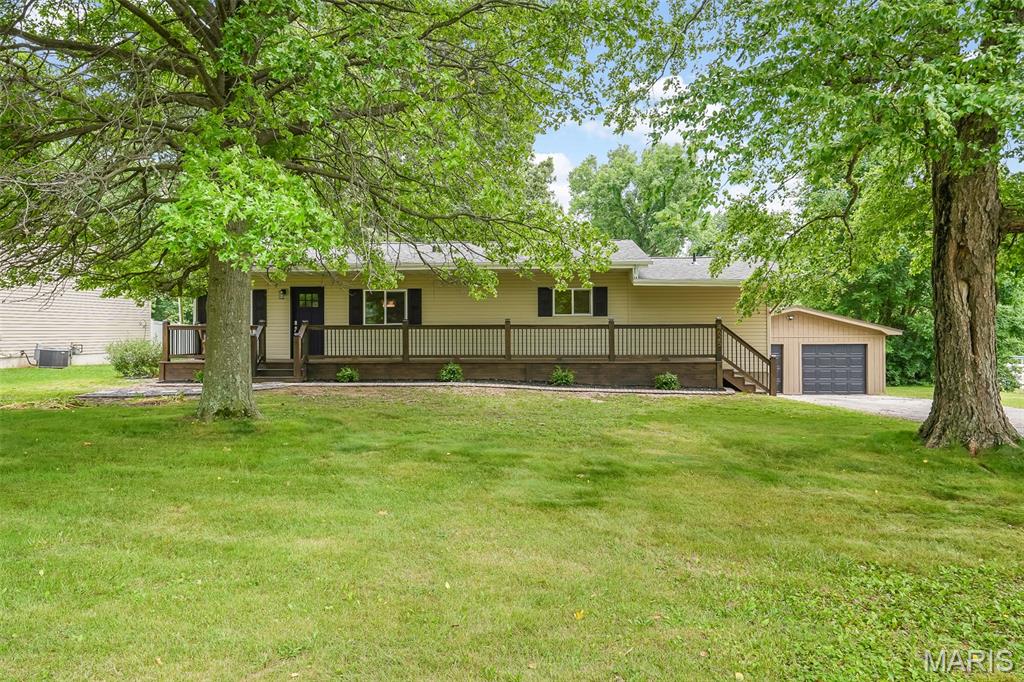 Here is your oppertunity own a newly renovated gem in the highly sought-after Wolf Branch school district! Situated on a sprawling one-acre lot, this home offers the perfect blend of modern luxury and country-style privacy. Every inch of the interior has been thoughtfully updated, featuring a bright and open floor plan. The home features a spacious detached two-car garage, wood burning stove, and ample room for outdoor entertaining, gardening, or future expansion on your private acre of land. With its turn-key finish and premier location near local shopping and dining, this property delivers a lifestyle of convenience and comfort. All measurements, square footage, and property details should be independently verified by the buyer or buyer's agent. This property is agent owned.