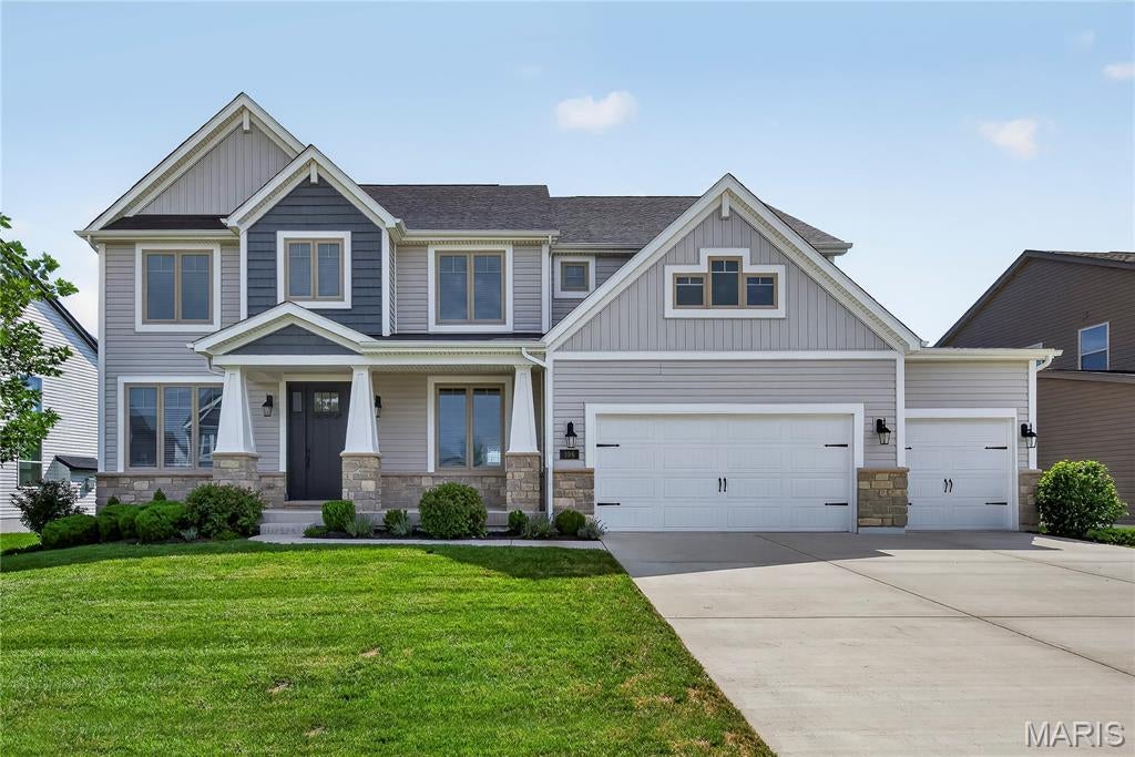 Impressive, 4 bedroom, 3.5 bath home with todays most desirable features and finishes!  This stunning home is located in the popular Streets of Caledonia neighborhood in O Fallon, with easy access to Highways 40/64 and 364, restaurants, incredible parks, shopping, services, healthcare and recreation.  The exterior is elegant with stone, vertical and shake accent siding, architectural shingles, carriage style garage doors, coach lights and an 8 ft tall Craftsman style front door.  Features include a gourmet Kitchen, island with seating bar, quartz countertops, tile backsplash, gas cooktop, stainless steel appliances, dishwasher, microwave, double wall ovens, chimney style range hood with stone surround, walk in pantry, 9 foot ceilings on the main floor, wrap around Butlers Pantry, large Breakfast Room, Sun/Hearth Room, luxury vinyl plank flooring, popular side staircase design, spacious Great Room, gas fireplace with stone to the ceiling, window wall, recessed lighting, Dining Room, Powder Room and a main floor Office with 8 ft glass double doors.  Upstairs there is a spacious Bonus Room and a Primary Suite with double door Entry, Primary Bath with soaking tub and marble shower, split raised height vanities and 2 walk in closets.  There are 3 large secondary bedrooms (all with walk in closets), 2 full bathrooms (1 Princess and 1 shared bath) and a Laundry Room with wash sink and wall cabinets.  There are two, hi-efficiency, HVAC systems. Enjoy 3,988 sq ft of smart, open and spacious living space.  The garage is oversized (25’8Dx31’3W) and has added storage shelving.  There is a patio off the Sun/Hearth Room for outdoor enjoyment. The lower level has a tall pour, egress window, rough in bath and rough in for a wet bar for an easy future finish if desired.  Residents have full access to first-class community amenities including 25 Acres of common ground, fountained lakes, walking trails, benches, gazebos, a neighborhood pool and clubhouse, covered pavilions, playground and pickle ball court.  Chesterfield Valley is minutes away and Lambert International is an easy commute. Students will attend desirable Wentzville schools.  So much to love, check it out!