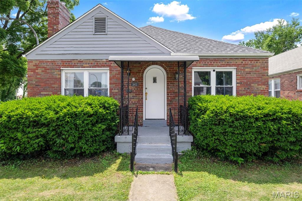 Welcome home to this updated brick bungalow situated on a spacious corner lot. Inside, you'll find beautiful wood flooring, abundant natural light, and a remodeled fireplace that serves as a focal point of the living area. The kitchen has been updated with stainless steel appliances, modern fixtures, and a clean, functional design.

The main level offers two generously sized bedrooms and a full bath with a tub/shower combination. Outside, enjoy the fenced backyard with a private patio, perfect for relaxing or entertaining. The partially finished basement provides additional living space with a sleeping area, and a full bathroom and plenty of storage.

Conveniently located near parks, schools, shopping, and dining, this home offers a great combination of character, updates, and everyday convenience.