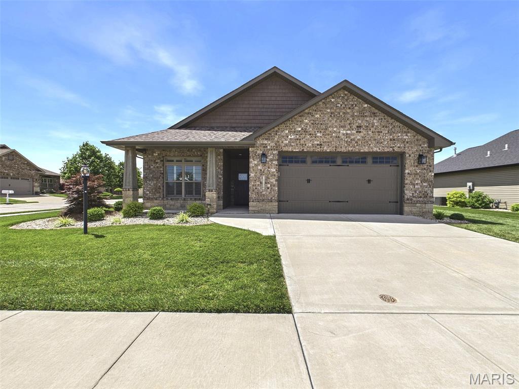 Welcome to sought-after Season’s Village in Glen Carbon, a premier 55+ gated community offering comfort, convenience, and carefree living! This stunning brick and stone ranch home is perfectly situated on a beautifully landscaped corner lot and features everything you need on one level. From the charming covered front porch to the fully fenced backyard and screened-in patio, this home was designed for both relaxation and entertaining. Inside, you’ll love the tall ceilings, luxury flooring, plantation shutters throughout, and the enormous amount of natural light that fills every room. The spacious open-concept layout includes 2 bedrooms, 3 bathrooms, a large living room with a cozy gas fireplace, and a beautiful kitchen complete with a center island breakfast bar, dining area, and oversized pantry. Main floor laundry adds everyday convenience. The impressive primary suite features a large walk-in closet, dual vanities, and a tiled walk-in shower with dual showerheads for a true spa-like experience.
Additional highlights include: All appliances included, including washer and dryer, Covered screened-in patio, Fully fenced yard, Incredible landscaping, 2-car attached garage.
Enjoy low-maintenance living with HOA services that include lawn care, shrub maintenance, common grounds, and subdivision entrance upkeep. This move-in ready home combines elegance, functionality, and easy living in one of Glen Carbon’s most desirable communities. Schedule your private showing today!