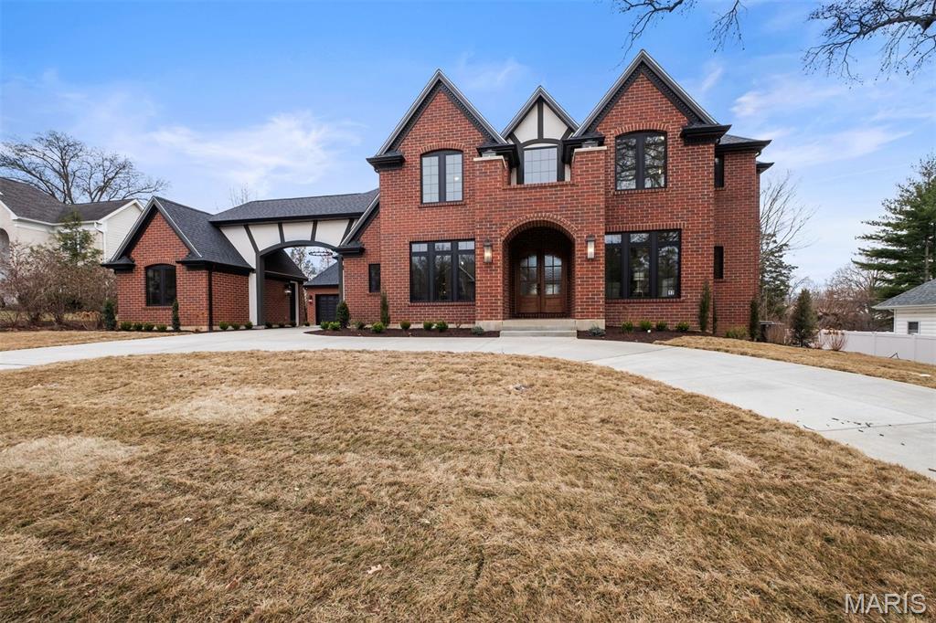 Exceptional Ladue schools custom home offering over 7,000 sq ft of luxury living space across three finished levels. This full brick residence features a stunning two-story great room with linear gas fireplace, 10’ ceilings on the main level, hardwood flooring, and extensive custom cabinetry throughout.
The gourmet kitchen includes high-end appliances, premium countertops, full-height tile backsplash, butler’s pantry, under-cabinet lighting, and upgraded lighting package. Main floor primary suite with coffered ceiling and spa-like bath featuring soaking tub and open-air shower. Main floor laundry/drop zone.
Upstairs offers additional bedrooms, bonus room, and hardwood hallway. The finished lower level (9’ pour) includes rec room, wet bar with refrigerator, theater room (pre-wired), exercise room, full bath, bedroom, and abundant storage.
Private in-law/guest suite with full kitchen, dining area, loft, hardwood floors, and covered patio access.
3-car garage with porte cochere, circle driveway with rear courtyard, covered porch, irrigation system, 3-zone 96% efficient HVAC, smart thermostats, humidifiers, advanced air filtration, make-up air system, pre-wired sound, and $12,000 closet shelving allowance.
Luxury, functionality, and thoughtful design in a prime location to schools, shopping and restaurants. Please see Feature Sheet.