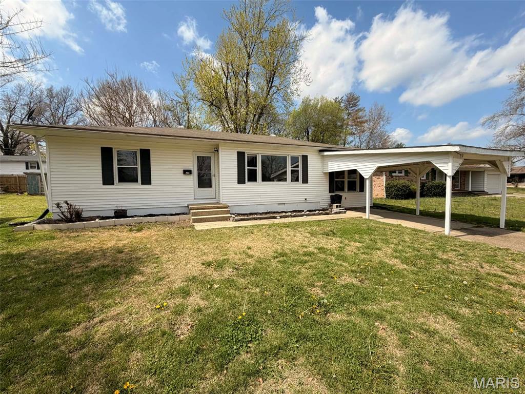 Welcome home to this beautifully updated 3-bedroom, 1-bath home offering comfort, convenience, and plenty of space to enjoy! Ideally located just two blocks from the school and only two blocks from Boone Park, this property combines a great location with move-in-ready appeal.

Step inside to find a spacious living room filled with natural light, generously sized bedrooms, an updated bathroom, and a functional kitchen featuring abundant built-in storage and workspace. The additional sunroom provides the perfect spot for a home office, playroom, hobby space, or relaxing retreat overlooking the backyard.

Outside, you'll love the large, fenced backyard with mature shade trees—ideal for kids, pets, gardening, or entertaining family and friends. A covered carport adds convenience and protection from the elements.

Whether you're a first-time homebuyer, looking to downsize, or searching for an investment opportunity, this charming home is one you won't want to miss!