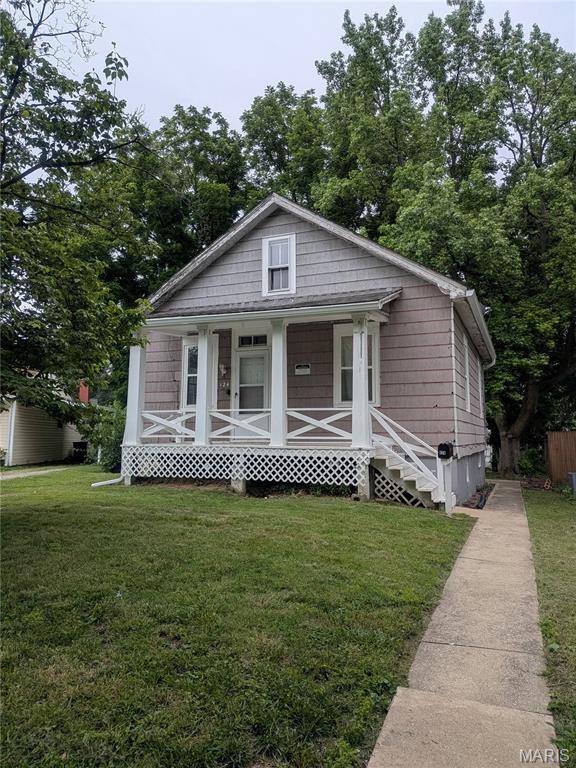 Attention Investors - Great Summer Project RIGHT HERE. Fix-her upper and redeem this sweet 1 1/2 story home. Fix and provide a worthy home for a new family whether you sell or hold as a rental. Inviting front porch, front living room and kitchen dining room combo with tall ceilings, entire main level needs all new flooring, upper level bedrooms are not heated nor cooled, but included in square footage and bedroom count. The basement is solid with rooms for workshop, extra storage, bonus areas, and an extra bathroom. The back yard is a clean slate with possibilities for a  future garage or carport. No through back alley stops at this property. Selling AS IS, with seller to do no inspections nor repairs, nor provide occupancy inspection certificate.