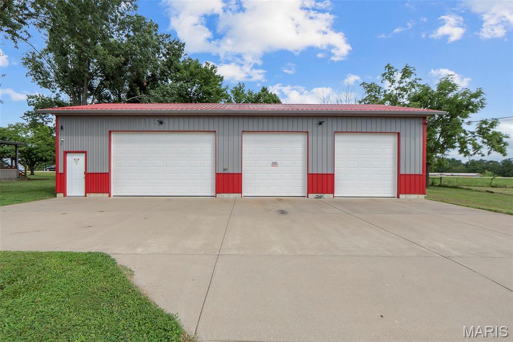 Position your business for success with this exceptional C-2 zoned 2.26-acre property offering highway frontage, strong visibility, and steady traffic flow along the Highway 51 corridor. Located in an area experiencing recent development, this site is well-positioned for continued commercial growth and accommodates a wide range of potential uses. 30x56 fully insulated metal outbuilding, constructed in 2018 by Ponder Built, featuring 12-foot ceilings, insulated overhead doors, concrete floor, metal-lined interior, bathroom with slop sink and toilet, shelving, desk, couch, permanent 2-post automotive lift, air compressor with plumbed air lines, and 3.5-ton HVAC unit with dehumidifier for year-round climate control. This building is potentially suited for a variety of commercial operations. The property also includes a 1,727 sq ft, 3-bedroom home with a full basement, providing flexibility for owner occupancy, office conversion, or on-site operational space during future development. An existing billboard lease adds additional income potential. With its strong exposure, zoning, and versatile improvements, this property offers an outstanding opportunity for investors, developers, or owner-users seeking a high-visibility commercial site along a proven corridor. Duplicate listing 25080826