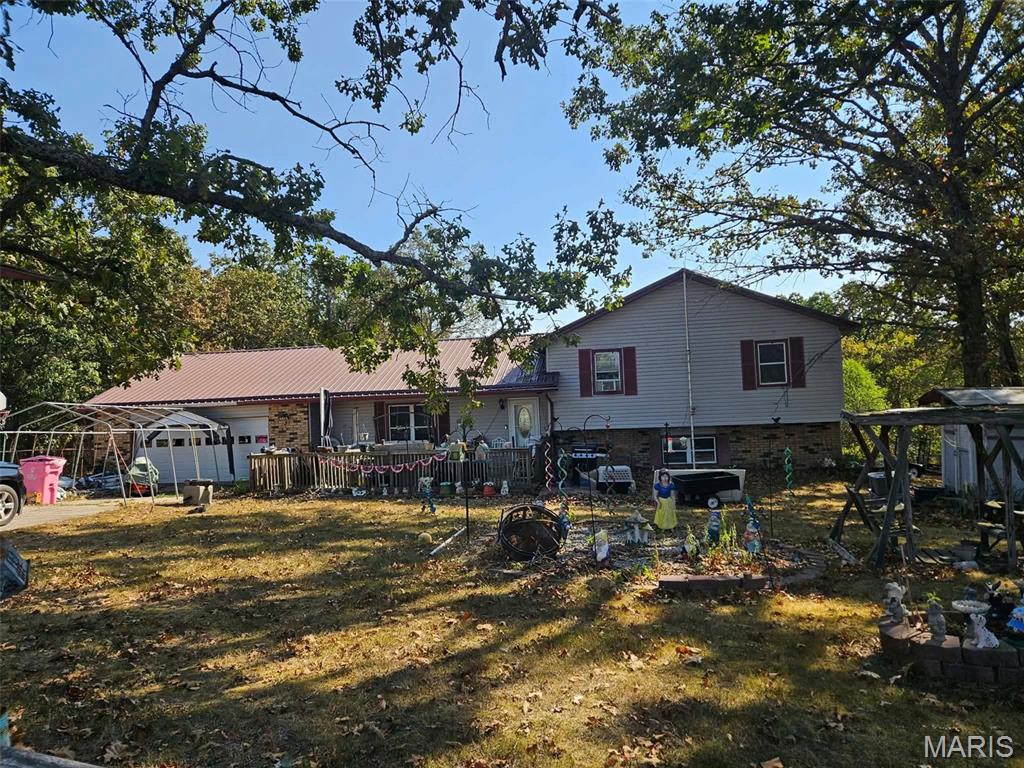 Tucked away at the end of the road, this tri-level home offers plenty of space, privacy, and extras! The property features a nice level yard, five outbuildings, and a two-car garage, providing abundant room for storage, hobbies, and outdoor projects. A metal greenhouse frame, riding lawn mower, and security cameras are included with the property. The above-ground pool is ready for a little TLC to bring it back to its full potential.

Inside, you'll find a large living room, spacious dining room, and kitchen with the major appliances staying with the home. The washer and dryer are also included for added convenience. The home offers nice-sized bedrooms, along with a second family room that provides additional living or entertaining space. Newer flooring on the lower level adds a fresh touch to the home.

With its level yard, multiple outbuildings, ample parking, and generous living spaces, this property offers plenty of possibilities both inside and out.