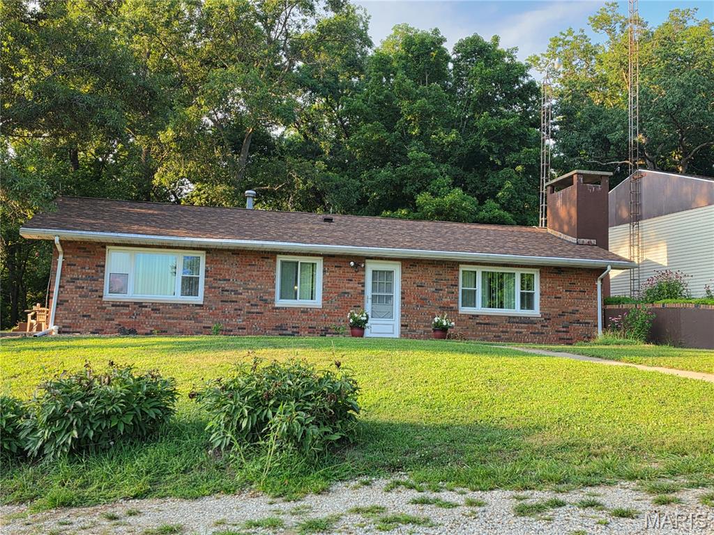 A rare find — one-owner home on 5+/- acres with built-in expansion potential!  Constructed in 1978 by Fuller Brothers, this home was designed to support a second story and features truss construction for easy interior redesign. Offering 3 beds, 2 baths, and a wood-burning fireplace that can also heat the boiler.  Property includes an oversized two car garage with workshop plus a 40' x 60' heated shop. New roof on house and garage in April 2024. Solid construction, great acreage, and endless possibilities!