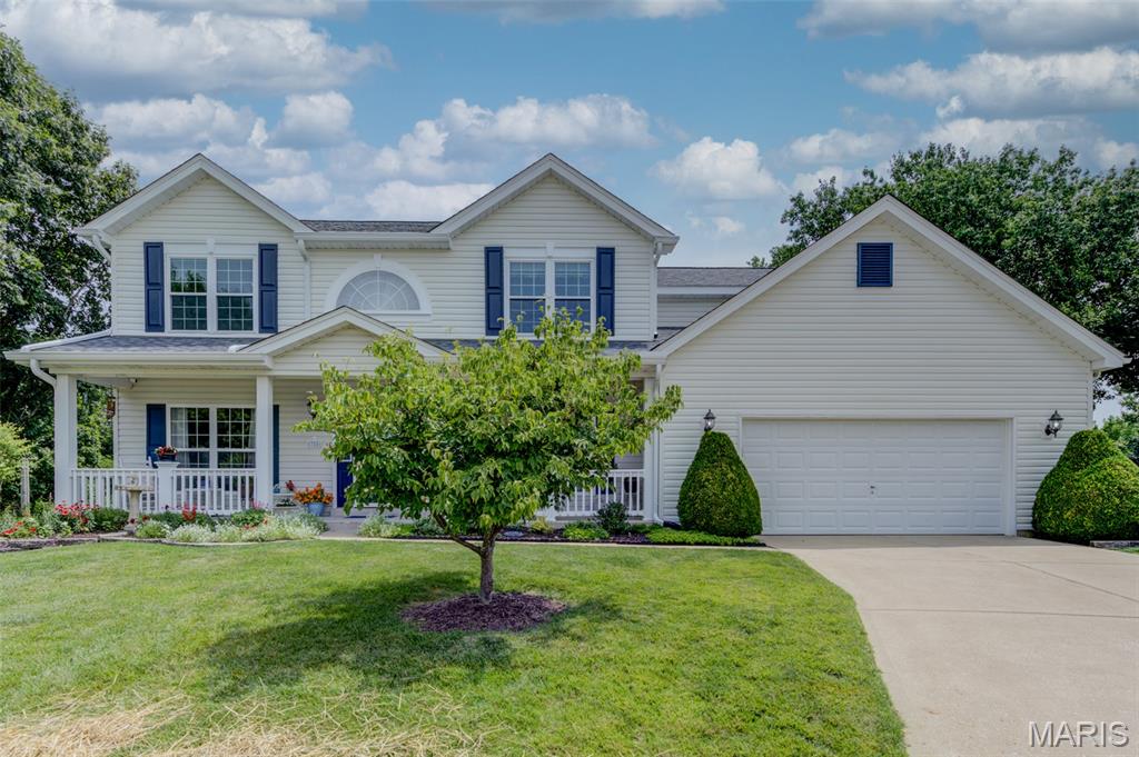 It's hard to find a setting like this anymore. Situated on a quiet cul-de-sac lot of over 1/3 acre, this beautifully maintained home offers the kind of backyard that made the original owners fall in love with the property nearly 30 years ago. Mature trees, a private wood-fenced backyard, beautiful landscaping, a heated pond, dedicated vegetable garden area, and abundant wildlife create a setting where there's always something to enjoy. Watch the seasons change from your patio and enjoy the beauty that surrounds you every time you step outside. From colorful flowers and birds to butterflies and the changing seasons, this is a backyard that feels alive. Whether you're enjoying a quiet morning on the patio or taking in the views from the bay windows, you'll quickly understand what makes this property so special. An inviting covered front porch opens to a large foyer, separate living and dining rooms, and an updated main level featuring luxury vinyl plank flooring. The family room features a full brick wood-burning fireplace surrounded by custom shelving, while bay windows in the family room and breakfast area fill the home with natural light and frame the peaceful outdoor setting. The kitchen was updated in 2025 and features quartz countertops, a center island, stainless steel appliances, and a new dishwasher. Main floor laundry with additional storage helps keep everything organized. An oversized 5-foot-wide staircase leads upstairs to the 22' x 16' primary suite featuring dual walk-in closets with a dressing area, double vanities, a walk-in shower, and a Roman soaking tub. Three additional bedrooms complete the upper level, including two bedrooms connected by a Jack-and-Jill bathroom with double sinks and a separate full hall bathroom. Additional features include an oversized garage with a utility sink, newer Lennox zoned HVAC systems, a whole-home humidifier, and newer windows. Significant improvements completed in 2025 include a new roof, siding, exterior lighting, roof vents, storm door, patio door, and kitchen updates. You'll feel miles away from it all, yet you're just minutes from Streets of St. Charles, Family Arena, shopping, dining, and major highways.