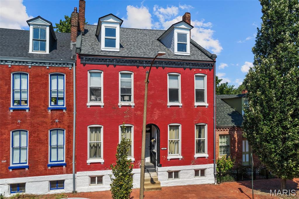Opportunity abounds on South 10th Street! Rarely does a property combine this much space, income, flexibility and lifestyle in historic Soulard. Tucked onto one of the neighborhood’s most coveted, quiet and tree-lined blocks, 1841 S 10th offers the comfort of a true single-family home, income from two existing apartments, hard-to-find off-street parking and one of St. Louis’s most social, historic and charming neighborhoods right outside the door.

Formerly two apartments, the entire second floor was combined into an expansive 1,750+ SF owner’s residence. Large rooms, soaring ceilings, abundant natural light, a spacious kitchen, dedicated in-unit laundry and thoughtful updates create a comfortable home while preserving the historic character that makes Soulard special.

Two updated first-floor apartments are occupied by long-term tenants paying $925 and $850 per month, providing $1,775 in day-one income. Market rents are estimated a$1,050–$1,100 per unit for long-term tradtional rentals and up to $1500 per unit for furnished or nightly rentals. Before becoming owner-occupied, the upper residence leased for $2,150 per month, creating multiple paths to income and long-term upside. First-floor tenants share laundry at the end of the main hallway. No basement stairs and no dark basement laundry room! Furnished, and / or nighlty rental rates coudl support $3,000/month income from this unit!

What makes this exact location so special is the peace and quiet. The unusual street pattern around South 10th and tiny Emmet Street limits through traffic, creating a tucked-away residential pocket just blocks from Soulard’s busiest destinations. You can live close to everything without having everyone pass your front door. The membership-based Frenchtown Dog Park is also just steps from the rear alley, adding a rare and desireable neighborhood amenity for dog owners.

In a neighborhood where parking is at a premium, the existing rear gravel pad, accommodating up to three cars, is a major advantage. Owners and tenants have dedicated off-street parking waiting at home, even during Mardi Gras and Soulard’s busiest event weekends, with additional on-street parking often available along this low-traffic block.

Then, the Soulard lifestyle. Meet friends for drinks on Molly’s year-round patio, treat yourself to Asian-Fusion and craft cocktails steps away from your front door at Stews. Late-night weekend slices at Epic Pizza, karaoke at Carson’s, catch live music at The Hi-Hat, or start game day at Duke’s and ride its shuttle to a Cardinals or Blues home game. Host Mardi Gras, pick out your golf cart, wander through Soulard Market and enjoy the patios, architecture, festivals and unmistakable energy that make this neighborhood unlike anywhere else in St. Louis, then come home to the quiet of South 10th.

Notable features and improvements include central air, updated electrical, PVC plumbing, more than $40,000 in updates and capital improvements since 2022, and a new roof in 2026. Move in and enjoy the amazing space today or unlock even more potential. The lofted attic features a dramatic vaulted ceiling, exposed brick walls and flexibility for many future uses. Prior architectural plans envisioned two additional bedrooms and two bathrooms, while the space could also become an office, studio, media room, fitness room or private retreat. The rear may offer additional possibilities for a private patio, enhanced parking or a future carriage-house concept.

Owner-occupant, long-term investor, furnished-rental or second-home buyer, 1841 S 10th St. checks all the boxes. Minutes from Downtown with convenient access to I-44 and I-55, plus easy connections to I-64/40, I-70 and Gravois, the entire metro region remains within easy reach.

Immediate income. A true owner’s home. Illusive off-street parking. Historic charm. The full Soulard lifestyle. Long-term upside. All at one unforgettable address. Opportunities like this do not come around often.
