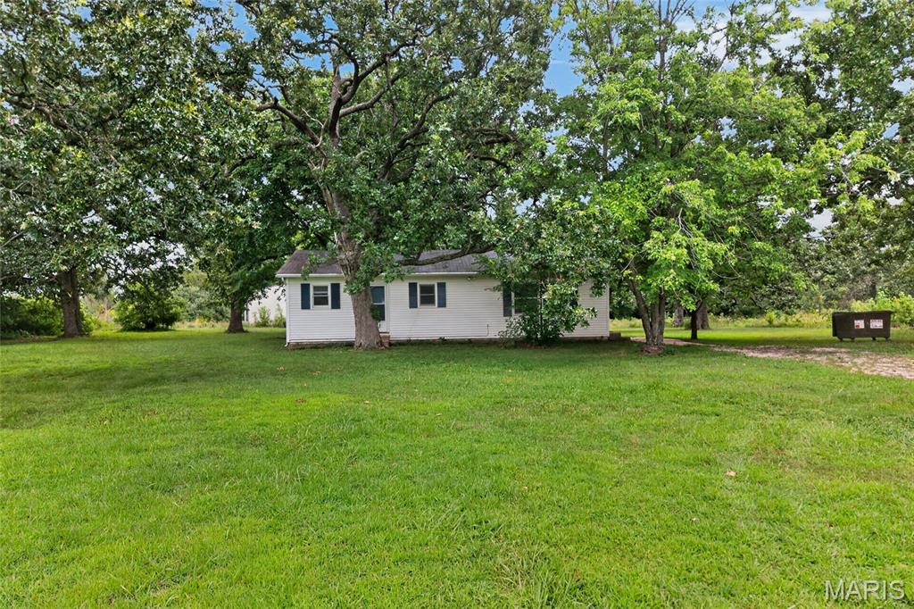 Enjoy the best of country living with the convenience of easy access to I-44! This charming 2-bedroom, 1-bath home sits on nearly an acre, offering plenty of space to enjoy the peaceful surroundings. Relax or entertain on the covered back deck while taking in the scenic country setting. The spacious lot provides room for gardening, outdoor activities, or future improvements, all while maintaining a tranquil rural feel. Whether you're looking for your first home, a weekend retreat, or an investment opportunity, this property combines peaceful living with a location that's just minutes from major highway access for an easy commute. Come experience the privacy, open space, and potential this property has to offer!