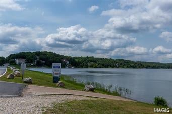 Second tier Lake lot with views of nice houses and the lake for the back drop! This exceptional building lot is located on Spring Lake in Raintree Plantation. This gated community is home to 3 lakes, and offers a beautiful golf course, pool, restaurant and beautifully paved road. This is a wonderful place to build your dream home in a lake community that holds its value.