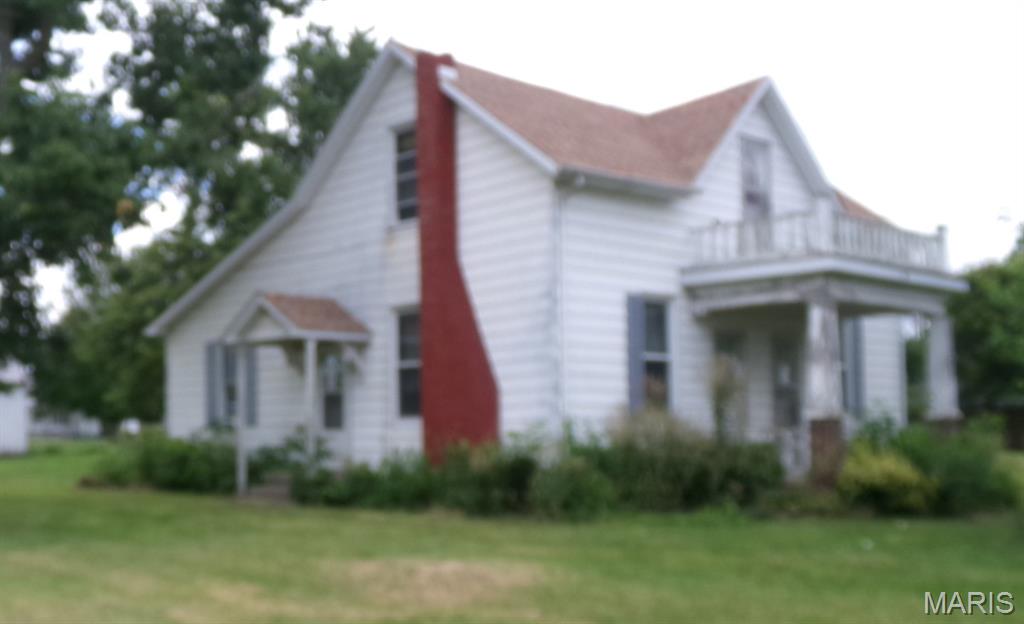 This is a 2 Bedroom, 2 Bath Turn of the Century home with a large living room & dining room. & an upper bonus room with a Cellar on a corner lot that Needs updating..