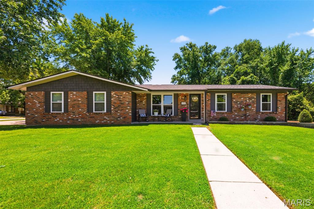 Welcome to a well-maintained ranch home perfectly situated on a desirable corner lot! This 3-bedroom, 2.5-bath residence offers comfortable main-level living with a functional and inviting layout. Step inside to find a spacious living area that flows seamlessly into the kitchen and dining space, creating an ideal setup for everyday living and entertaining. The main level features three nicely sized bedrooms, including a primary suite with its own private bath. The finished lower level expands your living space with a large recreation room, complete with a bar area—perfect for hosting guests or relaxing at home. You’ll also find a dedicated office area, a convenient half bath, and additional storage, giving the basement both function and flexibility. Newer HVAC, roof, siding, and windows provide peace of mind . Car enthusiasts, hobbyists, or those needing extra space will love the oversized 24x30 garage, fully heated and cooled for year-round use.  Enjoy outdoor living on the covered patio, offering a great spot to relax or entertain rain or shine. The corner lot provides added space, curb appeal, and versatility. Located in a convenient O’Fallon location close to shopping, dining, and major roadways, this home is a fantastic opportunity you won’t want to miss!