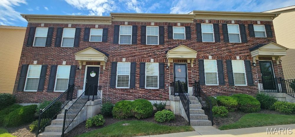 This awesome townhouse has a 2 car garage & basement!  Main level features open floor plan with large living area, kitchen which includes  smooth top stove, dishwasher, microwave and refrigerator. You will appreciate the social breakfast bar, 42" cabinets and pantry. Main level guest powder bathroom. Sliding door leads to steps down to the yard & sidewalk to 2 car garage. Upstairs you'll find nice sized owner's suite & secondary bedroom both with ceiling fans and walk-in closets and full bathroom with double sinks. There is also a small loft at the top of the stairs. The full basement has an egress window, rough-in plumbing for future expansion, sump pump and laundry area. Refrigerator, washer and dryer included in the sale.  The 2 car garage is accessed by alley entrance.  The Association maintains the outside and does your snow removal. Home has newer roof. There is a picnic pavilion in the complex. Make this wonderful townhome your new residence today!