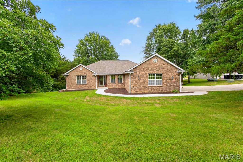 Welcome to this beautifully maintained home, thoughtfully updated and nestled on a gorgeous, wooded lot that offers the perfect blend of country living with the convenience of being just minutes from downtown Columbia. Step inside to an inviting, open living space designed for both entertaining and everyday comfort. The stunning kitchen is truly the heart of the home, featuring a large center island, abundant cabinetry, and a functional layout that makes meal preparation a pleasure. With four spacious bedrooms plus a non-conforming fifth bedroom, this home provides incredible flexibility for a growing family, home office, guest room, hobby space, or fitness area. Outside, you'll find your own private retreat. The patio and secluded backyard create the perfect setting for gatherings with family and friends, complete with a hot tub and pool for relaxing and enjoying the outdoors in privacy. The impressive 30x50 shop is the finishing touch that makes this property truly stand out. 
Whether you need space for your camper, side-by-side, vehicles, lawn and garden equipment, or a workshop for creative projects, this versatile building offers endless possibilities.
If you've been searching for a property that combines privacy, space, comfort and exceptional amenities, this one checks all the boxes.