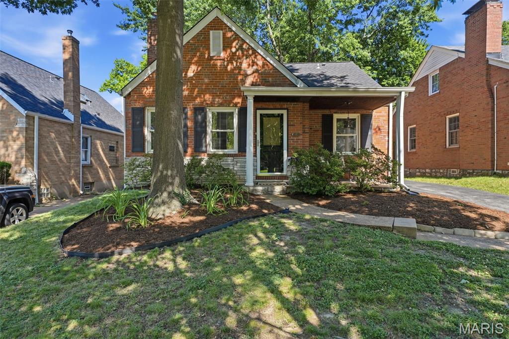 Picture perfect brick bungalow, filled with charm. Enter into the living room with wood-burning fireplace, and hardwood floors. The wood floors flow through into the dining room, and throughout the first floor. The updated, spacious eat-in kitchen is a focal point of the home, and opens to a covered rear patio. The first floor includes two nice sized bedrooms, plus a full bath. The primary suite is found on the second floor. It boasts plentiful closet space and a full bath with double sinks. There is a lovely deck just outside of the primary suite, a perfect place for morning coffee and a book. The unfinished basement offers plenty of storage space and laundry area. The owners have made great updates to a number of pieces of the home; Roof( 2021), HVAC (2023), Sewer lateral lining (2023), tuck pointing of chimney (2022) , electric service (2022), carpet , closets, and more. Walk to countless wonderful neighborhood dining spots, The Zoo and Turtle Park, public transportation is nearby and very easy access to highways 40/64 and 44. Garage being conveyed in "as is " condition. Home is code compliant for occupancy.