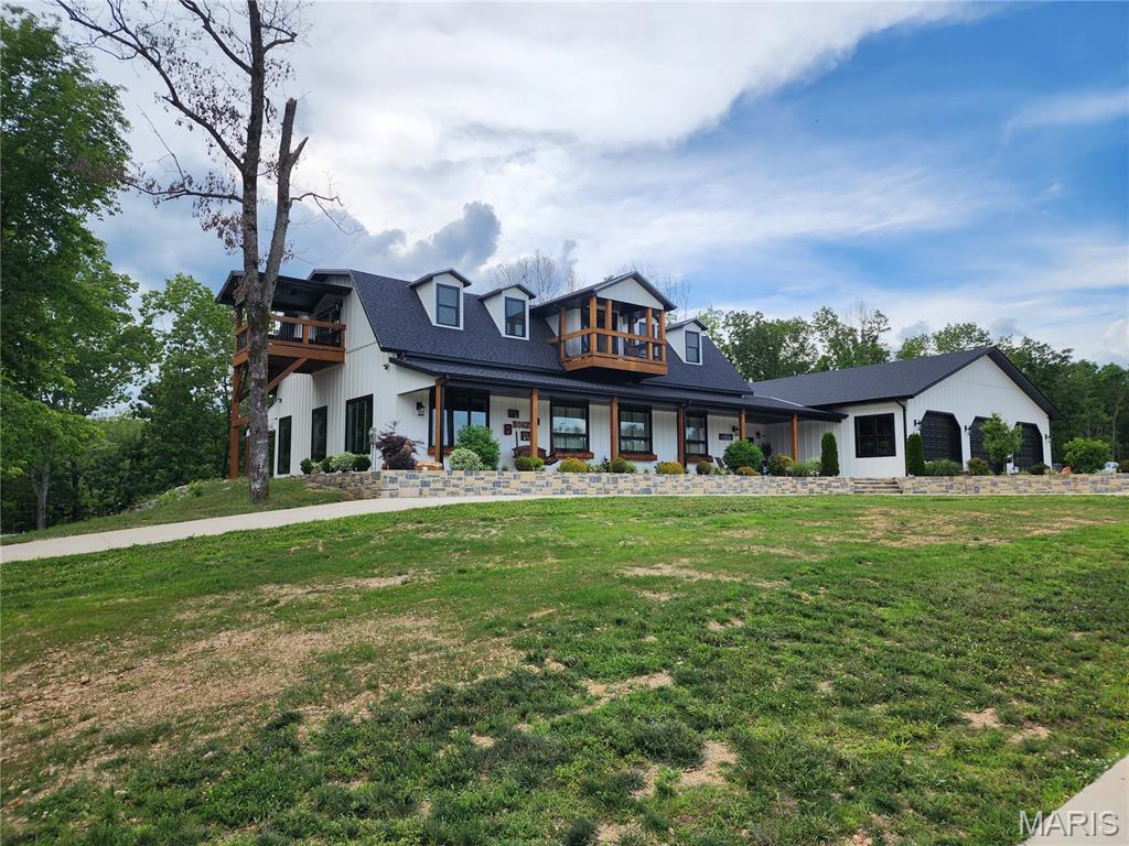 835 Monday Lane is an absolute stunning property.  This home has 4520 SF of living space and a 3500 SF attached garage/workshop for a total of over 8000 SF under roof.  This magnificent home was built by Integrity Design, one of the premier, custom home builders in the area.  Featuring 5 bedrooms and 4.5 baths, two kitchens, high ceilings, high end finishes and the best location in Butler County make this a must see if you are in the market for not just a home but an Estate to build your family's legacy.  Opportunities to purchase this kind of property don't come along very often.  The craftsmanship and attention to detail that went into building this home are second to none.  This home is being offered with 50 +/- acres of picturesque land.  Buyer will also have the choice of purchasing the home with 20 +/- acres.  Seller will provide survey depending on acreage agreed upon.  The maintenance free exterior, Generac, whole home generator, long, paved driveway, circle drive, massive, concrete parking area, covered front porch, covered back patio and really cool twin balconies put this home "over the top".  The living space is very impressive and then you walk into the garage and just go "WOW".  Schedule your appointment for a personal tour today.  It could change your life in a very positive way!
