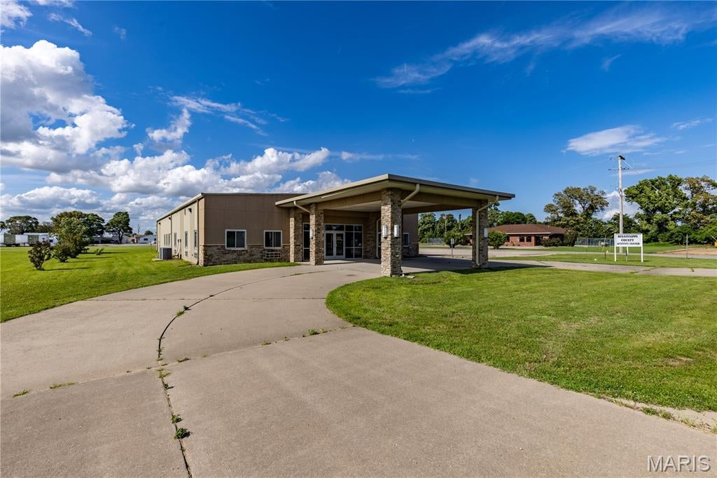 Looking for a great commercial building with a ton of space and almost 2 acres!  Here it is!!!!  This location sits right outside the city limits of East Prairie in the EP Industrial Park.  This beautiful building is located on a corner lot.  This building has a ton of possibilities with a covered drive through drop off on the front, large lobby area, beautiful reception are, multiple offices, kitchen area, storage, laundry area, and multiple bathrooms.  The building also has 2 over head doors and a bay area in the back for whatever your commercial business needs may be! Call and schedule your tour today!
**Covenants and Restrictions Apply**