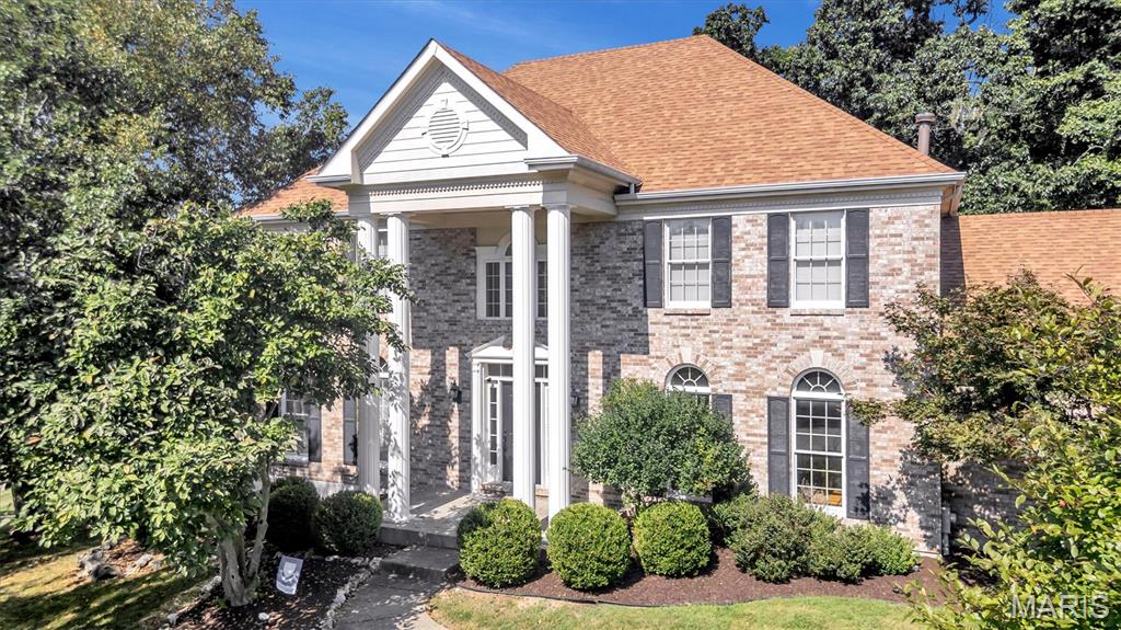 Tucked on a wooded lot in Wildhorse Village, this home greets you with a two-story entry that fills with light all afternoon. Warm hardwood runs through the main level. The living and dining rooms sit up front with tall arched windows, and the family room is where everyone ends up, built around a wood-burning fireplace with shelves and cabinets on either side and a wet bar steps away. The kitchen is the surprise: high vaulted ceiling, white cabinets to the top, a big island with seating, planning desk and a breakfast nook with doors right out to the deck. That deck wraps the back of the house and looks straight into the trees, no neighbors behind you. Main floor laundry completes the main level. Upstairs the primary suite is roomy and quiet, with a large walk in closet, its own bath, two vanities, a soaking tub and a walk-in shower. Three more bedrooms and a second full bath. The walk-out lower level is a blank slate, ready for whatever you want it to be. The community offers, three pools, tennis courts, ponds and trails in the neighborhood. Minutes to the Valley, that includes, shopping, dining, plus all the conveniences minutes away including Highway 40/64.