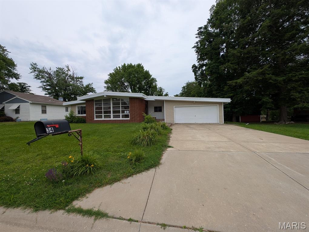 Welcome to 34 Wilshire Drive in Fairview Heights! This spacious ranch-style home offers an inviting layout with generous living areas designed for comfortable everyday living. Featuring a large living room, an expansive den with fireplace, a functional kitchen with dining space, 4 bedrooms, and 2 baths. Main-floor laundry adds everyday convenience. The partial basement offers extra storage potential, and the attached garage provides sheltered parking and workspace. Situated on a sizable lot in the established French Village Hills subdivision, this property presents an excellent opportunity to personalize and make it your own. Located in the heart of Fairview Heights, residents enjoy convenient access to shopping, dining, parks, schools, and major highways for an easy commute throughout the Metro East and St. Louis region. The home's location provides quick access to local amenities, recreational opportunities, and everyday conveniences that make this area a sought-after place to call home. ALL information is deemed reliable but is not guaranteed and should be verified by the buyer and/or buyers agent before making an offer.