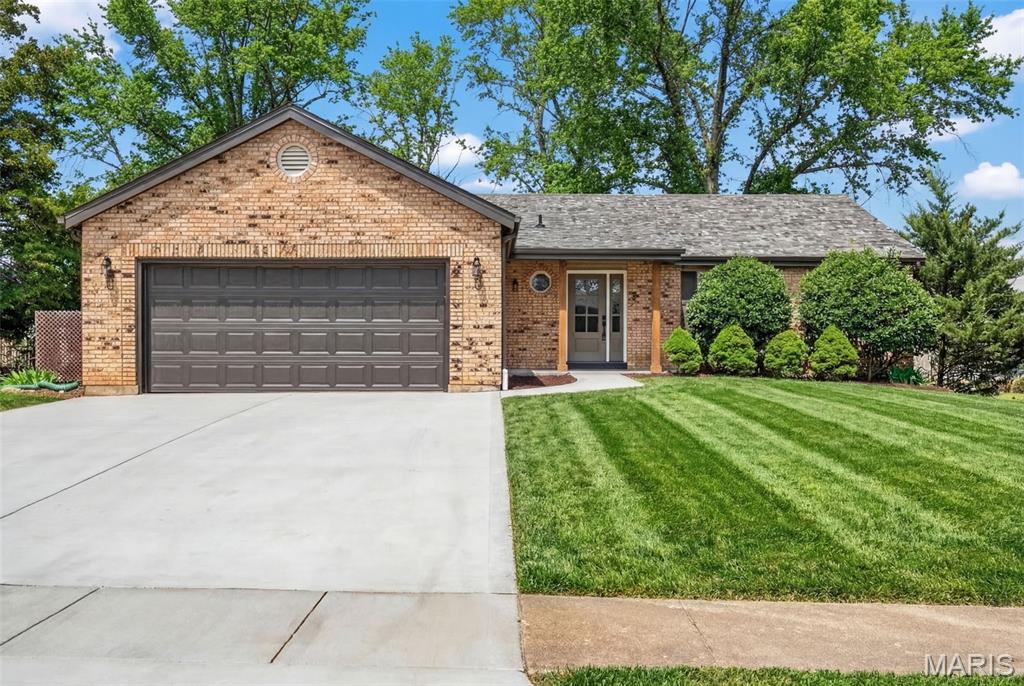 WOW! Jaw dropping & show stopping! Beautiful newly renovated open concept floor plan Ranch home with 3 main floor bedrooms, 3 full bathrooms, over 2500+ total sq ft, & newly finished lower level! Nestled on a corner lot in the desirable neighborhood of Reinke Woods in the heart of Ellisville, this home is a MUST SEE! You are welcomed into the soaring vaulted entryway & front family room that is light, bright & airy. The formal dining area is the perfect set up for entertaining (& impressing) family & friends doing holidays, gatherings or parties. Vaulted family room features gorgeous & trendy wood burning fireplace with mantle open to the gorgeous renovated kitchen. Let's talk about the newly renovated Kitchen - appointed with custom shaker cabinetry, beautiful quartz countertops carrying up the backsplash, stainless steel appliances and walk-in pantry - built in mind for a Chef! Head down the hallway to find the expansive primary bedroom suite with floor to ceiling tiled shower and huge walk-in closet. Two more generously sized bedrooms and beautifully finished hall bath. The finished lower level features an expansive Rec room with built in bar area plus FULL third bath. There is still a large unfinished space perfect for storage or future expansion. Main floor mud room & laundry, drywalled 2 car garage with newly poured driveway & patio for summer BBQs! Almost everything has been renovated - newly installed architectural roof, newly installed vinyl windows & 2 panel arched doors, newly installed flooring throughout, newly installed fixtures & lighting, it's like NEW without the new construction price tag. This the perfect home you have been searching for! This one is truly a gem! Schedule your private tour today! Agent Owned.