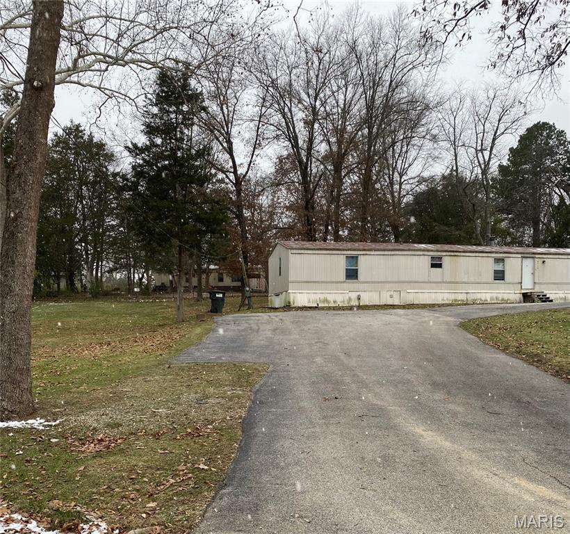 **PRICE REDUCED** Handyman Special ' Investors Special ' Seller is Motivated !! This is a must see home on a beautiful gently sloping, well maintained double lot ( nearly an acre ), in a small mobile home community. Purchase the land, and mobile home as an AS-IS  package !! There is a small utility/garden shed for yard equipment and storage items. Also, an asphalt driveway with extra parking. This property has so much more potential !! The mobile home is in need of cosmetic, utility, and mechanical repairs. Your vision will be a plus to make this home a wonderful place to reside in a semi-private setting in a peaceful community !! Being a double lot, this is one of the largest lots in Ormsby Estates !! Home is also in a most convenient location just north of Hillsboro Missouri off of Old State Route 21 near the Hayden Rd. access to new highway 21 and just minutes from shopping and the many conveniences that Hillsboro has to offer. Schedule your appointment soon as this one won't last long !!