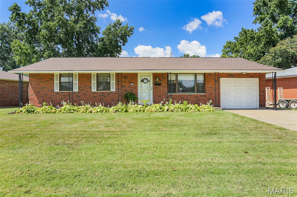 Move in ready and wonderfully maintained, this charming brick ranch is the one you've been waiting for! Offering 3 bedrooms, 2 bathrooms, an inviting living room and an abundance of natural light throughout.  The spacious kitchen offers plenty of room to cook and entertain, along with a convenient breakfast bar. The huge addition is the heart of the home, featuring an exposed beam ceiling and bar-perfect for entertaining family and friends! The master bedroom includes an adjoining half bath, with a full bath also conveniently located in the home. Enjoy the oversized front porch, large yard, backyard shed and one car attached garage with convenient access to basement. The wonderful basement provides additional space for storage, hobbies or recreation and includes the laundry area. Conveniently located within walking distance to Wilson Park, stores, restaurants and Granite City High School. Beautifully cared for, full of character and ready to welcome you home!