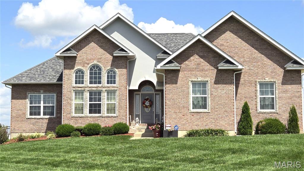 Discover a lifestyle of refined comfort at 13300 Sterling Hills DR, Rolla MO 65401. This distinguished single-family residence, constructed in 2012, offers an exceptional opportunity for sophisticated living, blending contemporary design with timeless appeal. This property invites you to envision a life where every detail contributes to a sense of well-being and effortless elegance. This property offers 5+ acres, 4 Bedrooms & 3 Full Baths with Approx 3000 sq ft.  The kitchen has beautiful Maple cabinets, newer stainless steel appliances, including a double oven, a big pantry & Eat In Breakfast Area.  This house has so many great living areas-Upstairs Living Room with a beautiful gas fireplace that will keep you extra cozy in the winter & give you back up heat.  There's an AMAZING Sunroom with an AWESOME view on the main level and a huge Family room downstairs for lots of activities. The Primary En Suite has a tray ceiling, separate shower and jetted garden tub with tile surround everywhere. A NEW ROOF was installed in 2026 and new gutters are still coming!  Lots of features have been upgraded and are newer and very well maintained. The 5+ acres offers beautiful views and country peace. This is one you will want to come home to every day.  An unparalleled opportunity to embrace an elevated living experience.
