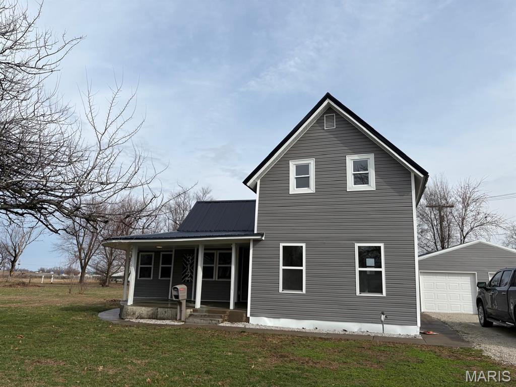 Welcome to your own slice of Missouri magic in the heart of Shelbina, Shelby County—a quiet, friendly town where the prairie breeze whispers through mature trees and neighbors still wave from porches.

Picture this: a freshly transformed story-and-a-half charmer, completely renewed and glowing with modern comfort while wrapped in timeless country soul.

Step onto the spacious covered front porch—wide enough for rocking chairs, iced tea, and long summer evenings watching fireflies dance. Fresh siding gleams under a brand-new roof, promising years of worry-free living.

Inside, crisp white walls reflect soft natural light, making every room feel open, airy, and inviting. The heart of the home? A stunning kitchen reborn with sleek new cabinetry, modern fixtures, and that perfect blend of farmhouse warmth and contemporary shine—ready for holiday baking, quiet coffee mornings, or friends gathered around the island.

Sink into the cozy window seat bathed in sunlight, a perfect nook for curling up with a book, watching rain patter on the glass, or simply dreaming. Both bedrooms offer generous closet space, while two full baths keep mornings smooth and stress-free.

Outside living beckons: a side wood deck for weekend barbecues, a peaceful side patio tucked away for private moments, and an absolutely massive yard stretching out beneath towering mature trees that shade lazy afternoons and frame golden sunsets. Kids, pets, or gardens? There's room for it all.

And don't forget the detached oversized two-car garage—plenty of space for vehicles, workshop dreams, or storing that lawn mower after mowing acres of green.

This isn't just a house—it's a lifestyle upgrade in peaceful northeast Missouri, where the updates are fresh (new HVAC, wiring, flooring, and lighting package throughout) and the charm feels forever.

Ready to make it yours? Come see the transformation for yourself—your peaceful country escape is waiting in Shelbina.