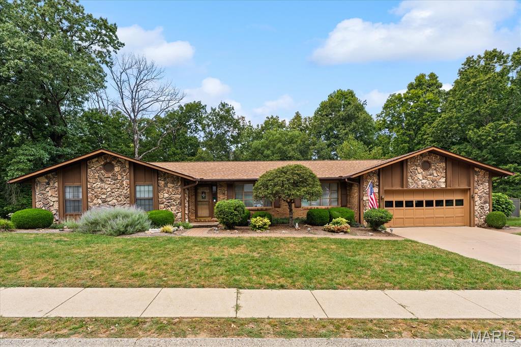 SPRAWLING RANCH ON 3/4 ACRE • 4 BEDROOMS • WALKOUT BASEMENT • 2 KITCHENS.   Space, privacy, and versatility come together in this sprawling 4-bedroom ranch, beautifully situated on a secluded 3/4-acre lot. Built in 1984, this well-established home offers generous room sizes, hardwood floors, and an abundance of features that make it an exceptional place to call home.

The spacious kitchen is designed for everyday living and entertaining, with an abundance of cabinetry and plenty of counter space. Two fireplaces add warmth and character to the living spaces, while the convenience of laundry on either the main level or lower level offers flexibility for today's busy lifestyle.

The finished walkout basement truly expands the possibilities, featuring a full second kitchen and plenty of additional living space. It’s perfect for entertaining, hosting guests, creating a recreation area, or accommodating extended family. A second staircase from the garage provides easy access to the lower level.

Outside, enjoy your own private retreat with approximately 3/4 acre of secluded grounds and plenty of room to relax, entertain, garden, or simply enjoy the peaceful surroundings. A whole-house generator provides added peace of mind, and the home's spacious layout offers endless possibilities. With its classic charm, generous living space, and private setting, this is a home you can settle into and make uniquely your own.

A wonderful opportunity to own a spacious ranch with room to live, grow, and enjoy for years to come!
