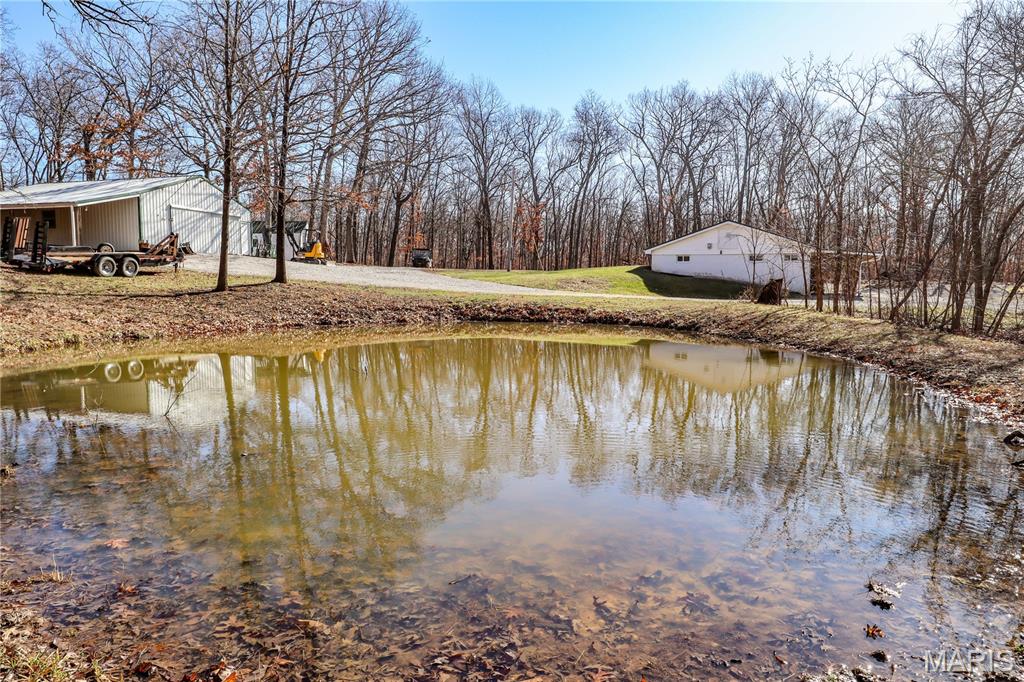 This exceptional farm near Mark Twain Lake offers the ideal blend of income potential, recreation and first-class whitetail habitat. The property features a beautiful mix of open ground and mature timber, creating the perfect environment for both farming operations and outstanding deer and turkey hunting. Several acres of open land are already established in food plots, but could be converted to farm land if desired. The surrounding timber is diverse and well-structured, offering natural bedding cover, travel corridors and excellent stand locations. A well-maintained internal trail system winds throughout the farm, allowing quiet access to hunting setups, food plots, ponds, and remote areas of the property. 

Multiple ponds are scattered across the landscape, offering dependable water sources for wildlife while also creating scenic views and additional recreational opportunities. The farm includes a comfortable 3 bed/1.5 bath cabin that serves as the perfect hunting retreat or weekend getaway. Nearby, a spacious 30x40 machine shed with concrete floors and electric provides ample storage for tractors, ATVs, implements, and hunting equipment, making property management easy and efficient. Strategically placed deer blinds overlook established food plots and high-traffic wildlife corridors, allowing the next owner to step right into a turnkey hunting setup. Whether you’re looking for a premier hunting property, a recreational retreat, or a versatile farm with both income potential and habitat value, this property checks all the boxes. The combination of productive open ground, quality timber, water features, and improvements makes this a rare opportunity to own a truly well-rounded farm.