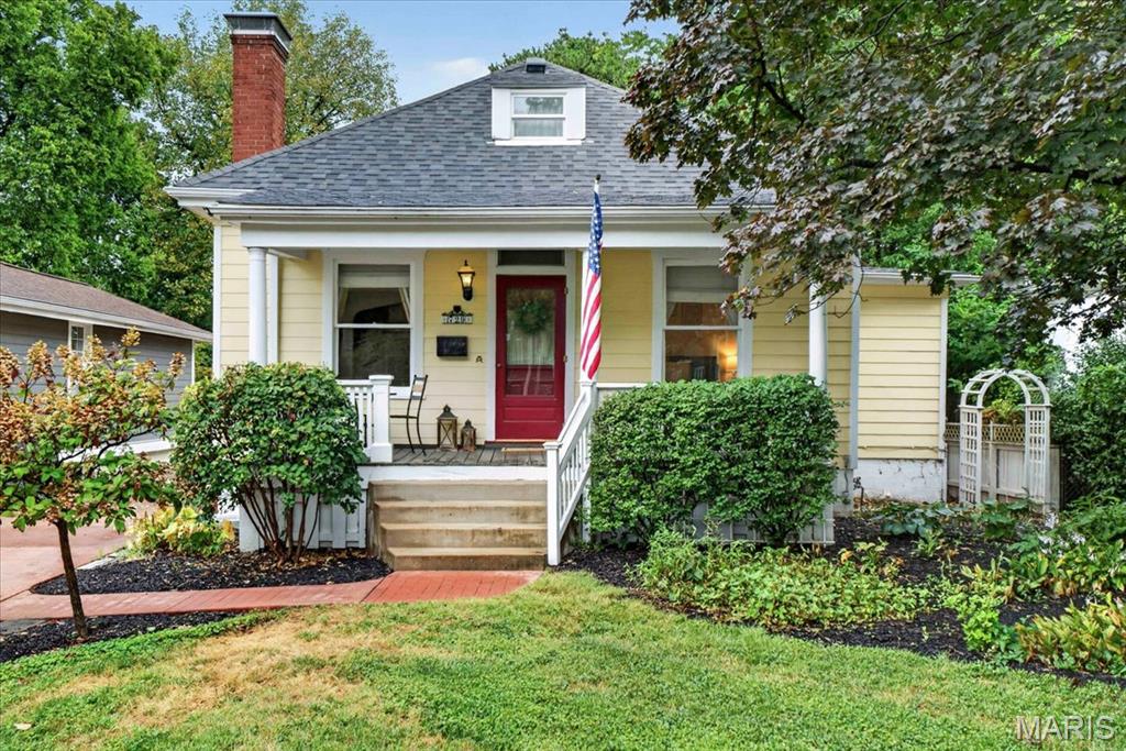Historic charm meets modern comfort in this beautifully updated Tuxedo Park cottage!  Built in 1883 and lovingly maintained, this special home is filled with character, including glass doorknobs, arched doorways, beautiful moldings, built-ins, and custom art glass windows. The inviting living room features a gas fireplace flanked by art glass and opens to a versatile sitting room, den or home office.  The main level primary suite offers two closets and an updated bath with heated marble floors.  The updated kitchen features custom cabinetry, pantry, double ovens, quartz countertops, and a farmhouse sink. The adjoining dining area is equally charming with wood floors, built-in seating and a hutch.  Upstairs you'll find flexible additional space ideal for a larger bedroom with cedar closet. Outside, enjoy the welcoming front porch overlooking beautifully maintained gardens, a private patio off the back of the home, a stamped concrete drive, fencing and detached oversized one-car garage.  New HVAC system (2026), new roof (2025), new hot water heater (2025) and irrigation system add peace of mind while thoughtful details throughout reflect pride of ownership. A wonderful opportunity to live in Tuxedo Park close to Avery Elementary, Margaret Park and Webster's Old Orchard area.