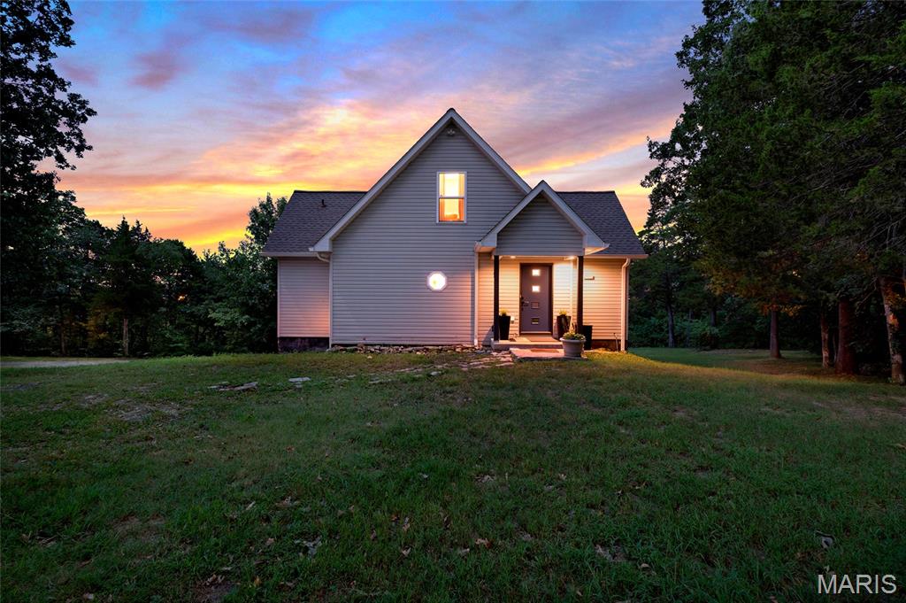 Showings to begin at the open house on 8/23 at noon.  Welcome to this completely rehabbed two-story home, perfectly situated on over 4.6 private acres. Thoughtfully updated throughout, this home offers modern finishes, abundant natural light, and peaceful outdoor spaces designed for enjoying the views.
Inside, you’ll find fresh paint and new flooring throughout, along with lots of windows that fill every room with natural light. The updated kitchen features a new island, countertops, hardware, faucet, light fixtures, and stainless-steel appliances—making it both stylish and functional for everyday living or entertaining.
The spacious living room opens through new Renewal by Andersen French doors to a large covered deck, the perfect place to relax and take in beautiful sunset views. The deck’s warm wood tongue-and-groove ceiling adds a charming finishing touch.
The primary suite offers a walk-in closet and a gorgeous, updated bathroom, complete with a freestanding soaking tub, new vanity, flooring, molding, and new fixtures. Additional updates include new ceiling fans, stairwell rails, and spindles.
Upstairs, a versatile lounge area can serve as a playroom, home office, reading nook, or bonus living space. Two additional bedrooms and a fully updated bathroom complete the second floor.
Outside, enjoy the added flexibility of a she-shed plus a garage/outbuilding—ideal for vehicles, storage, a workshop, or your favorite hobby. Private, move-in ready, and beautifully refreshed, this property offers the space and updates you’ve been looking for!