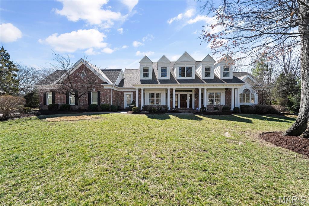 Stunning Curb appeal and Spectacular lot set the stage for this beautifully maintained 1.5-story home in a premier Frontenac location. Offering the open floor plan today’s buyer desires, this home blends timeless charm with thoughtful updates and exceptional indoor-outdoor living. The spacious main-floor primary suite is a true retreat, featuring two walk-in closets and direct access to the veranda and pool—your own private outdoor oasis. The luxurious primary bath includes double vanities, a soaking tub, and a separate shower. The main level also offers a formal dining room, private office, soaring ceilings, and a stunning kitchen and hearth room that flow seamlessly to the expansive veranda and pool area—ideal for entertaining and everyday living. Upstairs, you’ll find three generous en-suite bedrooms anchored by a versatile loft/family room, plus an additional second-floor laundry for ultimate convenience. The high-pour finished lower level expands the living space with a large family room, office/workout room, additional bedroom, full bath, half bath, and abundant storage. An oversized 3-car garage and numerous updates—including new paint throuthout, new roof, Hardie Board siding, newer garage doors, water heaters, select appliances, whole home generator, and enhancements to the pool and surrounding area—offer peace of mind and move-in ready convenience. Lush, mature landscaping surrounds this exceptional property, creating a private, park-like setting on nearly an acre in one of Frontenac’s most sought-after locations.
