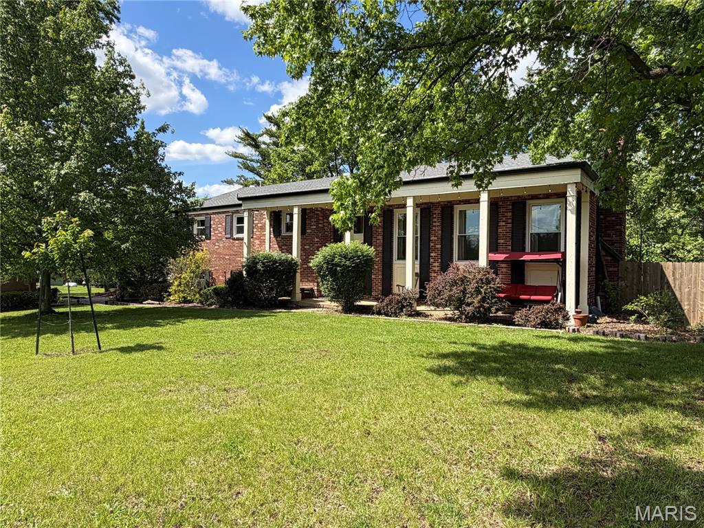 Charming multi- level brick home on 7+ acres within Hermann city limits! This home offers the perfect blend of country living with in-town amenities. Enjoy the privacy and space of a wooded setting while still being just minutes from shops, dining, and local conveniences. Featuring 4 bedrooms and 3 bathrooms, the layout provides room to spread out while still feeling connected. The large living room centers around a fireplace with a wood insert, creating a warm and inviting gathering space. Recent updates include new windows and a newer roof, adding to the home’s overall appeal and efficiency. With generous living areas, there’s plenty of room for entertaining family and friends. The attached 2-car garage is finished and insulated, making it ideal for a workshop, hobbies, or additional storage. Outside, the wooded acreage offers a peaceful setting with room to explore, all while being conveniently located in town. A small fenced area provides a safe space for kids or pets to play. A perfect opportunity if you're needing lots of space plus close proximity to town!  Multiple parcels (7 acres) included with this sale.