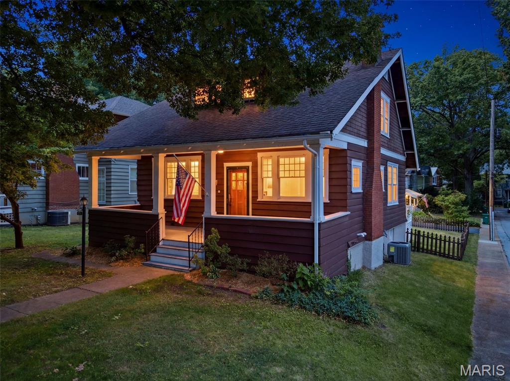 Welcome to 125 S Elm Avenue, a beautifully updated Webster Groves home perfectly situated on one of the area’s most beloved tree-lined streets. This light-filled 3-bedroom, 2.5-bath home blends timeless character with thoughtful modern improvements, including a remodeled kitchen with custom American Cabinetry, Hallmark Stone countertops, and new oven, microwave, and dishwasher in 2025. The inviting main level features charming living and dining spaces, a decorative fireplace with built-ins, French doors, and a bright kitchen/family room connection ideal for everyday living. Upstairs, the main bedroom offers impressive custom built-in closet systems with mirrored doors, illuminated interiors, drawers, shoe trays, and dedicated hanging space, along with two additional bedrooms and a full bath. The walk-out lower level provides additional flexibility with a semi-finished basement, rec room/office potential, full bath, laundry, and storage. Additional updates include new HVAC in 2024, new light fixtures and electrical updates in 2025, Trex porch and stairs in 2026, and a new basement door in 2026. Enjoy a covered front porch, brick patio, and a detached 2-car garage with convenient access off Elm Place, a quiet cul-de-sac street. All of this in a prime Webster Groves location close to shops, restaurants, parks, and everyday conveniences.