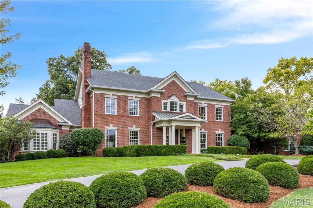 Superior craftsmanship and distinctive design define the architectural integrity of this exquisite 9,027 sq ft 1.5-story residence by Hayden Custom Homes. An impressive two-story marble foyer, highlighted by a dramatic curved staircase, sets the tone and leads to a private study with fireplace and built-in bookcases, an elegant dining room, and a stunning great room featuring a marble fireplace, wet bar, and a breathtaking wall of windows. The designer kitchen is both beautiful and functional, showcasing buff cabinetry, granite countertops, commercial-grade appliances, an exceptionally large center island, and a butler’s pantry. It flows seamlessly into the breakfast room with an octagonal ceiling and a vaulted hearth room with a striking floor-to-ceiling fireplace and built-in bookcases. The coffered primary suite offers a luxurious retreat with a wide bay window and a beautifully appointed marble bath. Front and rear staircases lead to bonus room, three additional bedrooms, each with ensuite access. All secondary bathrooms have been beautifully updated, and the second-floor bedrooms feature newly installed designer wool carpeting. The walk-out lower level is designed for both relaxation and entertainment, offering a spacious recreation room with wet bar, game room, office, workout room, hobby room, wine cellar, and a full bath. A spectacular four-seasons room from Mosby Building Arts showcases a stacked stone fireplace, gathering bar, second kitchen and atrium doors that open to an outdoor living area with a covered patio, Baker gunite saltwater pool and spa, pool bath, and a linear fireplace - all surrounded by professionally landscaped gardens. Located just steps from the renowned Bellerive Country Club, this home delivers luxury living at its finest.