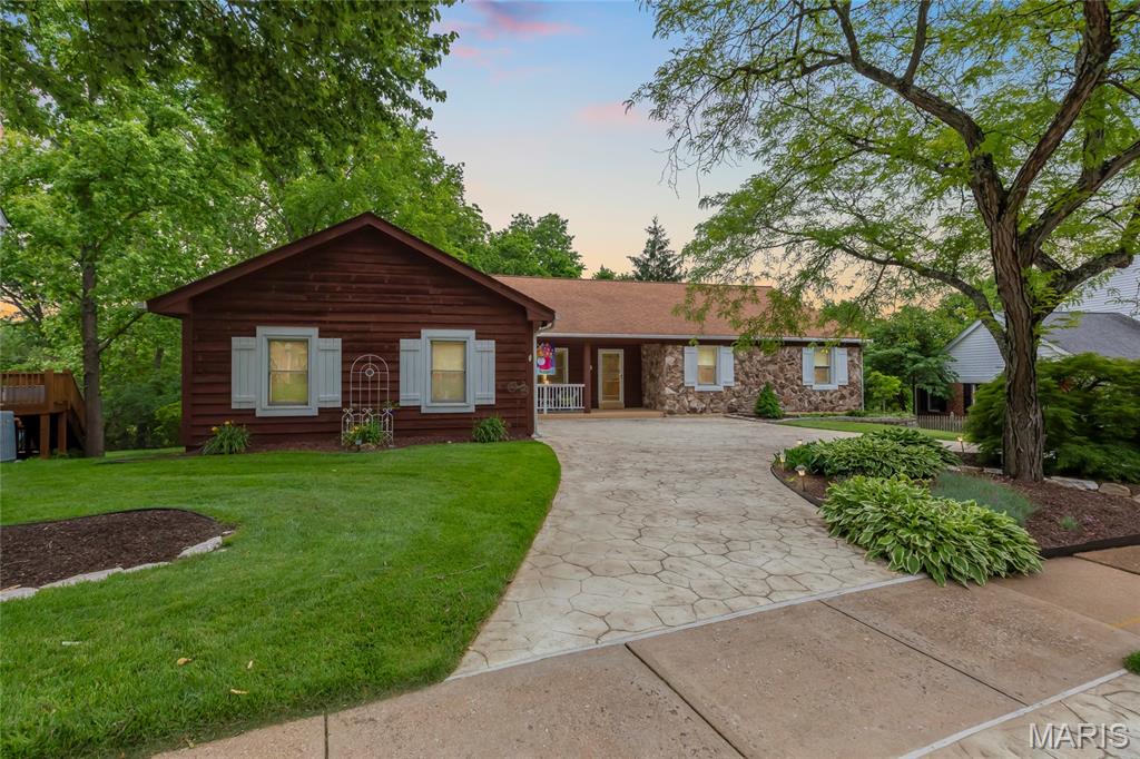 Location, location, location! Beautiful ranch home in the highly desirable Lafayette Farms neighborhood. This 4-bedroom, 3-bath residence features a sunken great room with vaulted ceilings and beautiful woodwork throughout.

Main level includes an office space with built-in bookshelves, a kitchen and breakfast room that flow seamlessly into the formal dining featuring abundant natural light.

Enjoy gorgeous views from the rear windows overlooking mature trees and open green space-creating your own private oasis.

The walk-out lower level offers a spacious family room, an additional bedroom and full bath, plus a large amount of unfinished space with endless potential.

Step outside to a raised deck and hot tub, perfect for relaxing or entertaining. The home also features a circular Bomanite concrete driveway, adding exceptional curb appeal. Move in and enjoy all the benefits of living in this beautiful, established neighborhood!