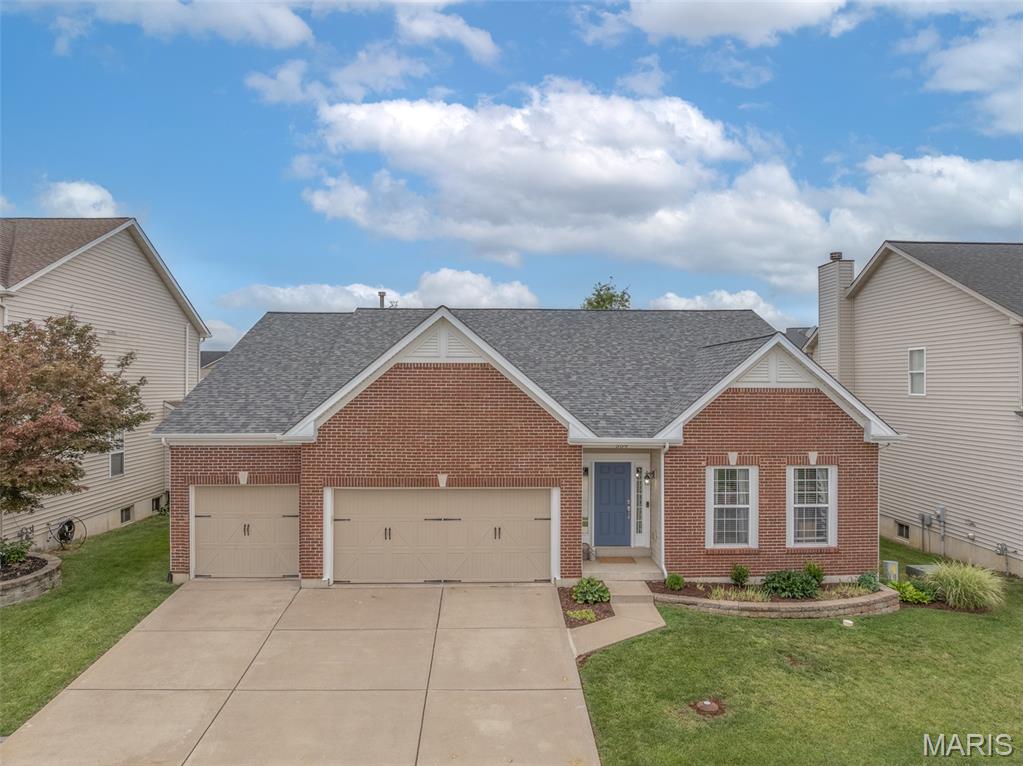 Located in a fantastic Lake St. Louis neighborhood, this beautifully maintained ranch offers over 3,750 square feet of finished living space and backs directly to the neighborhood playground. It's the perfect setting for anyone looking for space, convenience, and community. Step inside and you'll immediately appreciate the open floor plan, tall ceilings, and abundance of natural light. The spacious kitchen is designed for both everyday living and entertaining, featuring a huge breakfast bar, generous prep space, and room to serve gatherings of any size. The adjoining breakfast room is ideal for casual family meals, while the separate dining room offers flexibility and is currently being used as a stylish home office. 
The living room is warm and inviting with a woodburning fireplace, large windows, and plenty of room to relax with family and friends. The main level features three generously sized bedrooms. The private primary suite is thoughtfully separated from the secondary bedrooms and includes a completely remodeled bathroom with a stunning custom walk-in shower, soaking tub, and a large walk-in closet. The two additional bedrooms share a beautifully updated full bath. Check out the custom closet organizers! The finished lower level provides incredible additional living space. A large recreation area with custom built-ins and bar create the ultimate gathering spot for game days, movie nights, or entertaining guests. There's also a versatile flex room that could serve as a home gym, office, playroom, or hobby space. A half bathroom is already in place, making the lower level both functional and convenient. Outside, the flat backyard offers plenty of room for play, pets, and outdoor activities. The patio is the perfect place for grilling. Best of all, the backyard opens directly to a neighborhood playground—kids can walk across the yard and start playing within seconds. Additional features include a three-car garage, attractive brick front exterior, low-maintenance vinyl siding, and a long list of included appliances: washer, dryer, both refrigerators, stove, microwave, and dishwasher. Lovingly maintained by its original owners, this home has been thoughtfully updated and cared for since day one. Residents enjoy access to neighborhood amenities including a pool, tennis and pickleball court, and playgrounds. Conveniently located near shopping, dining, parks, and easy access to both Interstate 70 and Highway 40. This is the kind of home families wait for—move-in ready, exceptionally maintained, and located in one of Lake St. Louis' popular communities.
