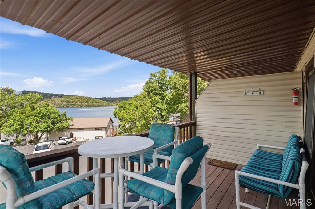 Lake Life Starts Here! This charming 1BR/1BA end-unit condo at Weston Point Resort delivers the perfect blend of location, lifestyle and investment potential in the heart of Osage Beach at the 23MM. Offered TURNKEY and NIGHTLY RENTAL approved, this cozy retreat is ready for immediate enjoyment or income potential. Relax on the covered deck, then spend the day enjoying the lakeside community pool with panoramic main-channel views, tennis courts or convenient boat ramp. The park-like setting creates a peaceful escape while keeping you close to Lake favorites including Margaritaville, LandShark, RedHead Lakeside Grill, Shorty Pants and Paradise. Additional perks include boat trailer parking, community laundry and blacktop access. All furniture, decor, electronics, appliances, BBQ grill and patio furniture are included. Whether you're searching for an affordable Lake of the Ozarks getaway, full-time retreat or vacation rental investment, this move-in-ready Weston Point gem checks the boxes. Your Lake escape is waiting! Enjoy one-level living, central air and a prime end-unit location with easy access to everything Osage Beach offers. Pack your bags and start making lake memories today!