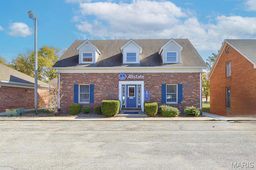 Income-producing, all-brick office building located on a highly traveled corridor in Collinsville, IL. Established single tenant, currently generating a dependable $12,000 per year at existing rental rates with the tenant responsible for all utilities. The existing lease runs through October 1, 2026, offering immediate cash flow and a clear timeline for re-leasing or repositioning. This well-maintained property contains a total of 10 office spaces arranged for efficient daily operations and flexible reconfiguration. The main floor features five offices, 3 private offices and 2 open workspaces, along with a reception area and 2 restrooms. The upper level provides five additional offices, a restroom, and utility room housing, a furnace and a second circuit breaker panel. The finished basement delivers a communal area, a kitchenette with sink, a fourth restroom, and a utility closet with the second furnace and an additional circuit breaker panel. Six dedicated parking spaces serve tenants and visitors. The building, equipped with zoned HVAC thereby reducing single-point operational risk and simplifying phased tenant transitions. The property, zoned for commercial use suited to professional office tenants and service providers. This asset presents a straightforward, income-generating opportunity with near-term upside. The October 2026 lease expiration gives an investor flexibility to renegotiate, convert to a multi-tenant structure, or pursue owner-occupancy. Visible frontage on a high-traffic corridor and the adaptable interior layout make the building attractive to medical, legal, financial, and small professional service tenants seeking convenient access and signage exposure.