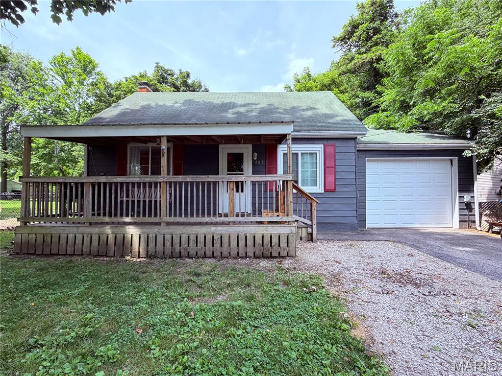 Move right into this beautifully updated ranch offering comfort, convenience, and modern updates throughout! This charming home features 2 spacious bedrooms, 1 full bath, and luxury plank flooring throughout the home for a seamless, contemporary look. The spacious kitchen provides plenty of room for cooking and gathering, and kitchen appliances— refrigerator and stove—will stay with the home. Enjoy the convenience of a main-floor laundry room and the peace of mind that comes with major updates, including a new AC unit and water heater installed in 2024. A whole-house water filtration system is also included. Step outside to a huge fenced backyard complete with a storage shed, offering plenty of space for pets, play, gardening, or entertaining. The garage is uniquely equipped with overhead doors on both the front and back, providing easy access and versatility, while extra off-street parking adds even more convenience. Enjoy front porch sitting on the large covered front porch! Tucked away in a quiet setting, this home offers privacy while remaining close to everyday amenities. Don't miss your opportunity to own this move-in-ready gem! Sold as is. Seller will not do repairs not provide city occupancy. City occupancy to be done by buyer after closing.