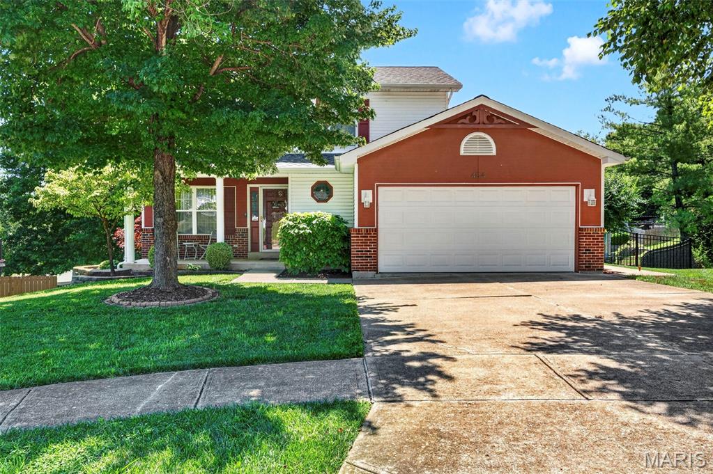 Spacious two-story home in the desirable Fox C-6 School District offering approximately 1,800 sq. ft. of finished living space! The main level features luxury vinyl plank flooring, crown molding, a living room, dining room, and a cozy family room with a wood-burning fireplace. The kitchen offers white cabinetry, quartz countertops, stainless steel appliances, pantry, large sink, and walks out to the deck overlooking the backyard.

Upstairs you'll find the primary suite with a walk-in closet and private bath, along with two additional bedrooms and a full hall bath. The finished walk-out lower level provides additional living space with a spacious rec/family room, half bath, laundry area, and plenty of storage.

Outside, enjoy the deck overlooking the backyard complete with black aluminum fencing and a fire pit. Additional features include white six-panel doors and trim, white faux wood blinds, a two-car garage with opener, and a Ring camera system. Roof and HVAC both under 10 years old. Ideally located just minutes from Gravois Bluffs shopping, dining, and entertainment, with quick access to Hwy. 30, I-270, and everyday conveniences.