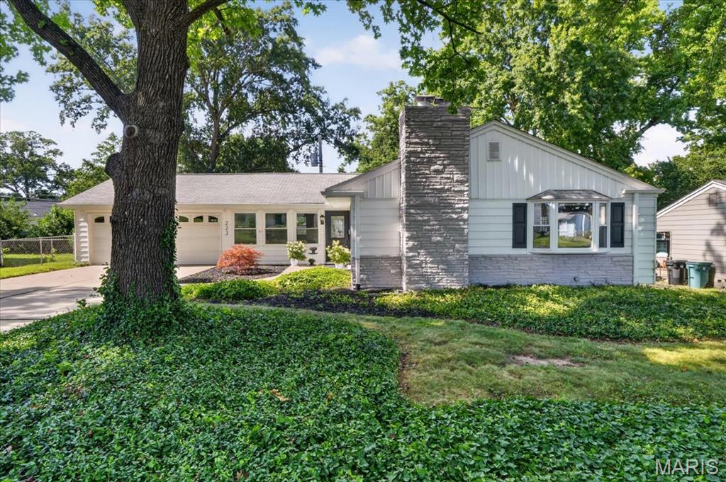 ATTACHED OVERSIZED TWO CAR GARAGE!
Welcome to this beautifully appointed ranch home in Kirkwood, where timeless charm meets thoughtful updates. The entry opens into an expansive family room featuring brand-new luxury flooring and built-in display shelving. Filled with natural light, the inviting living room is anchored by a gas fireplace, creating a warm and elegant gathering space.
The dining area showcases a bay window and a breakfast bar that seamlessly connects to the kitchen. The kitchen is equipped with updated stainless steel appliances, including a built-in Whirlpool microwave with convection and air fryer modes, a new Kohler sink and disposal, and a built-in gas stove and oven, all set in classic white cabinets. 
On the main level, you will find a generously sized primary bedroom, two additional bedrooms, and a main bathroom updated with a new Kohler toilet, plumbing fixtures, and a newer  Kohler walk-in shower. You will appreciate the refinished hardwood floors throughout the main level.
Downstairs, the partially finished lower level features new carpeting, a wood-burning fireplace, and a fully updated half bath with a new vanity and toilet, and ample storage. Fresh interior paint and new lighting on the main level enhance the home’s refined yet contemporary appeal. An oversized attached two-car garage adds both convenience and exceptional value.
Outdoors, a deck just off the kitchen and an expansive patio create an ideal setting for effortless entertaining and everyday enjoyment. Enjoy a level, fenced-in backyard perfect for endless activities! A newer Amana dryer and washer are also included. Newer Hot Water Heater installed.
R-40 insulation is installed to help keep your utility bills reasonable. With mature trees, you will also appreciate the professionally installed gutter guards for ease of maintenance. 
Top-rated Kirkwood Schools, minutes from Highway 40/64, train station,  The Performing Arts Center,Magic House, Farmers Market with shopping, restaurants nearby