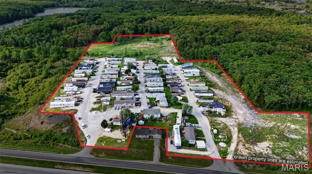 Incredible Income Producing Asset in the fastest growing Corridor off Hwy 70 in Wright City. This Trailer Park offers 68 Pads, all fully rented with extra room for development if desired. The Parcel sits on 23+/- Acres and is surrounding by new construction and less than 5 Miles from the New Meat Processing Facility for American Foods. The Asset is Grossing over $425,000.00 Annually. None of the trailers are park owned and the landlord pays for Sewer,Water, and Trash. This is an excellent Buy and Hold for future Development, while collecting strong income along the way.
