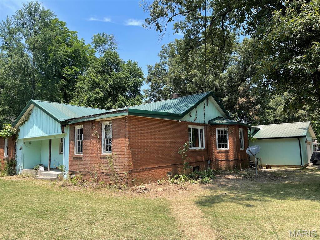 Bring your imagination! Large corner lot, great location!
