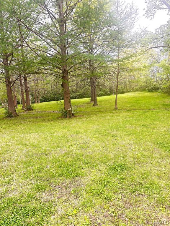 Beautiful walk-out building site off of Maple Grove Rd. 1.49 acres, electric & water at the rd.  Currently wooded but can easily be cleaned out.
 There is currently a path around the property- there are a couple of stakes marking property lines
on back of property.  Will try to get front marked off.  There isn't any parking to view property unfortunately.