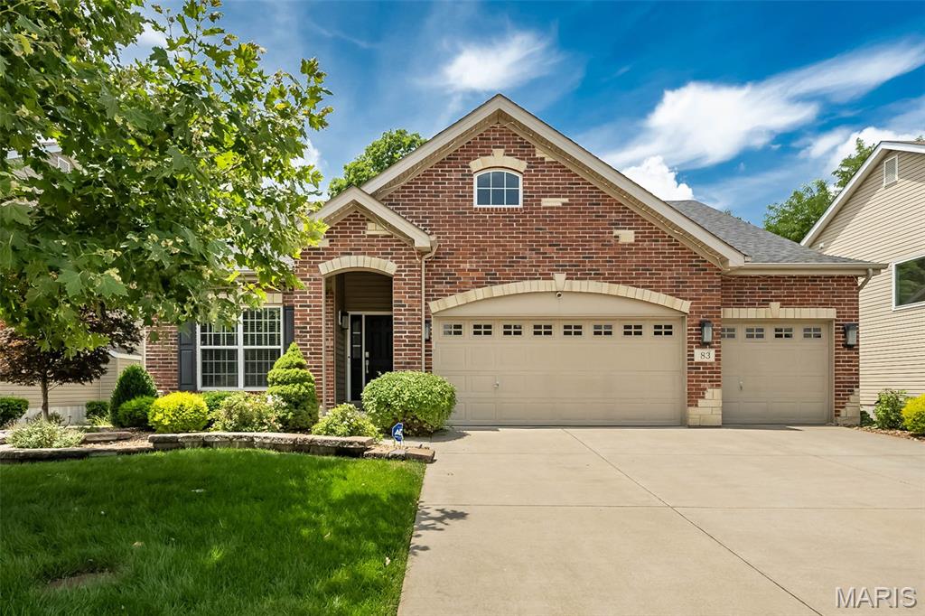 Welcome to this beautiful ranch home in the desirable Wyndgate Subdivision, offering a sought-after open floor plan, split-bedroom layout, and a fantastic setting near the back of the neighborhood. Tucked on a cul-de-sac backing to trees, this home combines privacy, curb appeal, and everyday functionality. The brick and stone front elevation, lush landscaping with irrigation system, and oversized 3-car garage create an impressive first impression.

Step inside to a bright and spacious main living area featuring vaulted ceilings, beautiful laminate flooring, and a gas fireplace that anchors the open great room. The kitchen flows seamlessly into the dining and living spaces, making it ideal for entertaining and everyday living. You’ll love the 42” cabinetry, gorgeous countertops, breakfast bar island, stainless steel appliances, ample pantry space, and separate dining area. The split-bedroom design provides added privacy, with the spacious primary suite tucked away from the secondary bedrooms. The primary retreat features coffered ceilings, a walk-in closet, and a luxury bath with dual sinks, garden tub, and separate shower. Two additional bedrooms, a full hall bath, and a convenient laundry/mud room complete the main level. The lookout basement offers excellent natural light and a blank canvas ready for your future finish. Enjoy all that Wyndgate has to offer, including subdivision amenities such as walking trails, pool, sport courts, picnic area, and more. A wonderful opportunity in a highly desirable neighborhood!