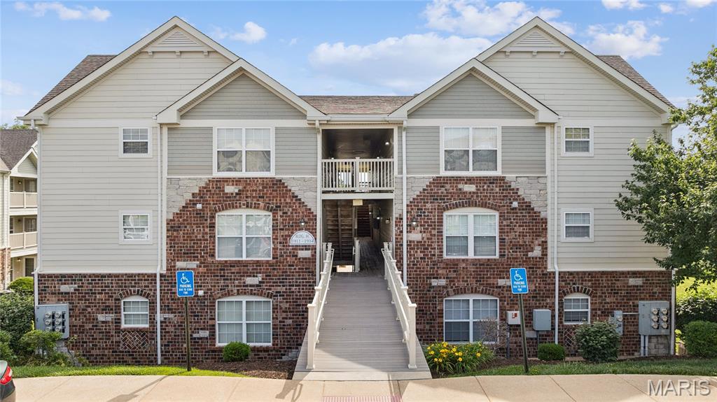 LOOKING FOR A LOW-MAINTENANCE CONDO WITH SOARING VAULTED CEILINGS, LOW HOA FEE, IN AN EXCEPTIONAL LOCATION? This beautiful 2 bedroom condo offers comfort, convenience, and value, all just minutes from Highway 94, Highway 364, and Highway 40. Enjoy easy access to shopping, restaurants, parks, and everyday amenities while coming home to a peaceful, well-maintained community. Step inside to an open and welcoming floor plan highlighted by vaulted ceilings throughout, creating a spacious feel that's perfect for both relaxing and entertaining. The eat-in kitchen features a pantry and flows seamlessly into the living area, making everyday living both functional and comfortable. The primary bedroom includes a walk-in closet and direct access to the full bath, while the second bedroom offers flexibility for guests, a home office, or hobbies. You'll also appreciate the convenience of your own private laundry room and a large interior storage room—ideal for seasonal decorations, extra clothing, additional storage needs, or even a home office. Also a new A/C June 2026!  Enjoy your morning coffee or unwind after a long day on the covered deck, complete with an additional storage closet. As a desirable corner top-floor unit, this home offers added privacy, fewer shared walls, and a quieter living experience with only 1 flight of stairs for easier access. This condo includes a dedicated parking space for added convenience. The community is known for its beautifully maintained grounds, walking paths, and green spaces, making it a wonderful place to enjoy a stroll with your dog or simply spend time outdoors. Plus, the HOA fee is lower than many comparable condo communities, offering excellent value without sacrificing amenities or upkeep. A favorite neighborhood coffee shop is conveniently located at the entrance to the community, giving you a charming local spot to grab coffee, meet friends, or enjoy a weekend treat just steps from home. With vaulted ceilings, generous storage, 2 bedrooms plus a storage room big enough for a home office, new A/C installed 6/12/26, lower HOA fees, beautiful grounds, and a highly desirable location, this move-in-ready condo offers an easy lifestyle you'll love coming home to.